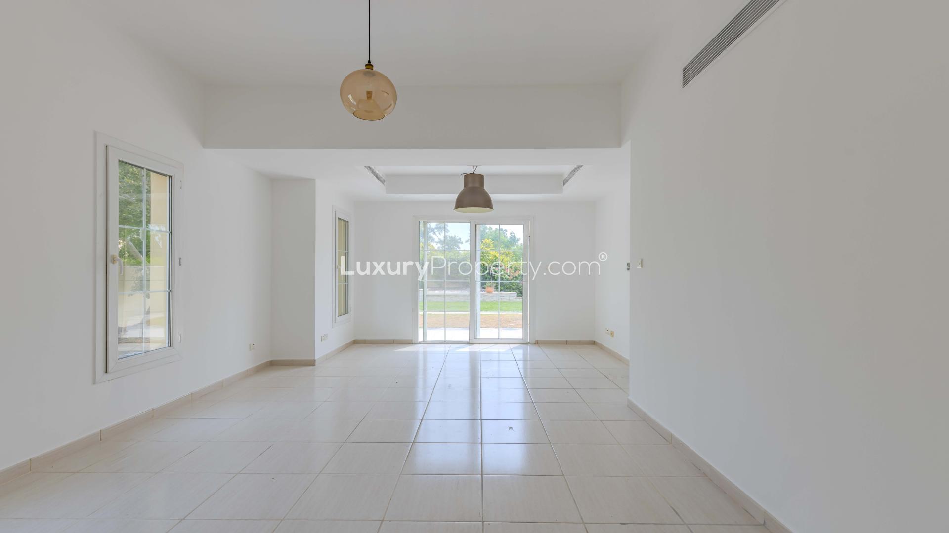 Bright living area in 3-bedroom villa, Springs 2, featuring large windows and modern lighting