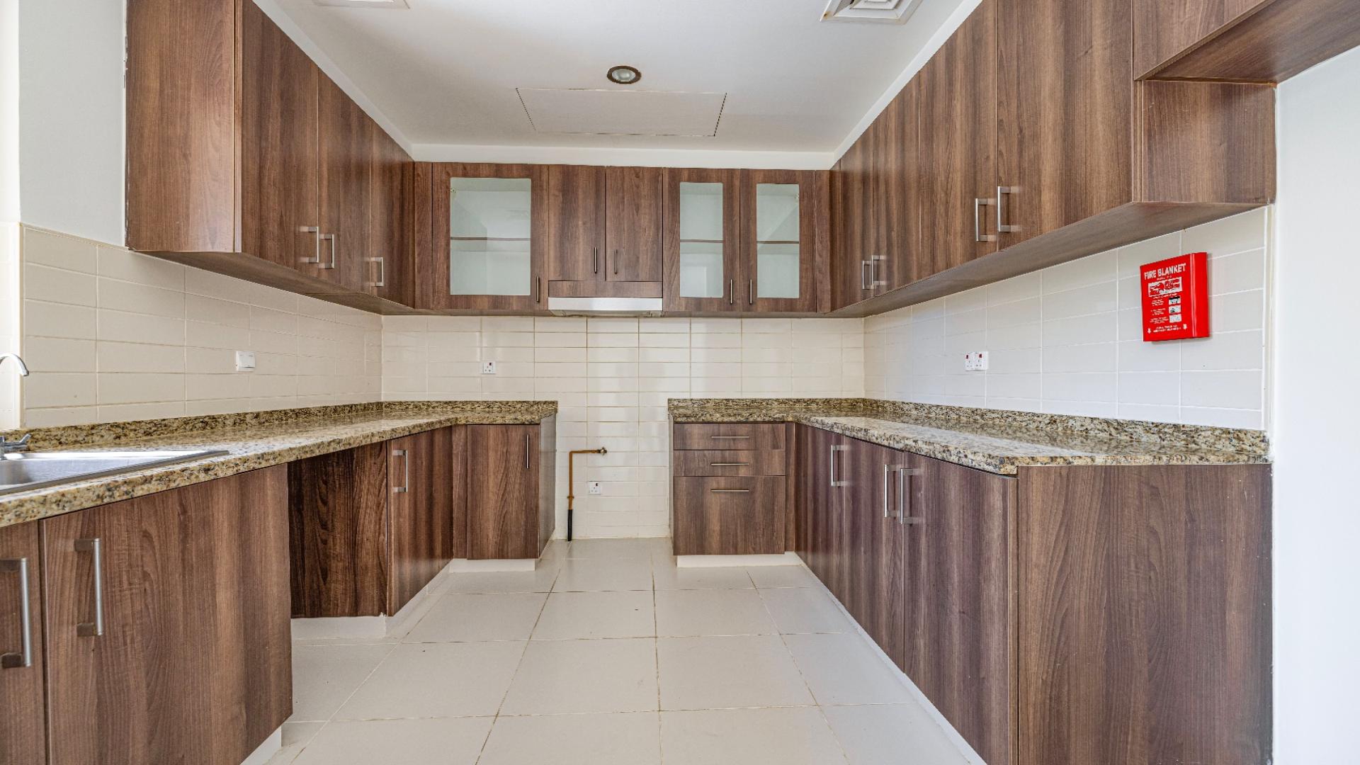 Modern kitchen in elegant 3-bedroom villa, Mira Oasis, Reem community, available for rent