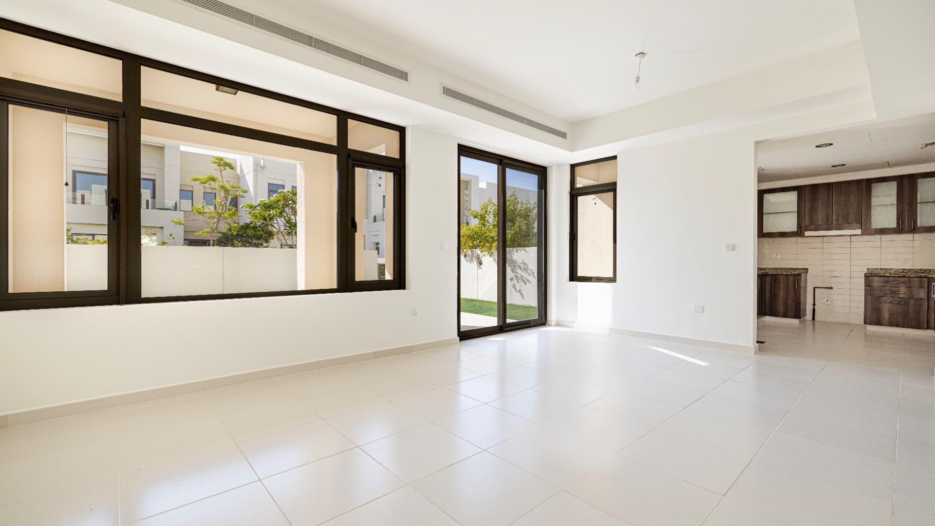 Elegant 3-bedroom villa exterior with lush garden in Mira Oasis, Reem community