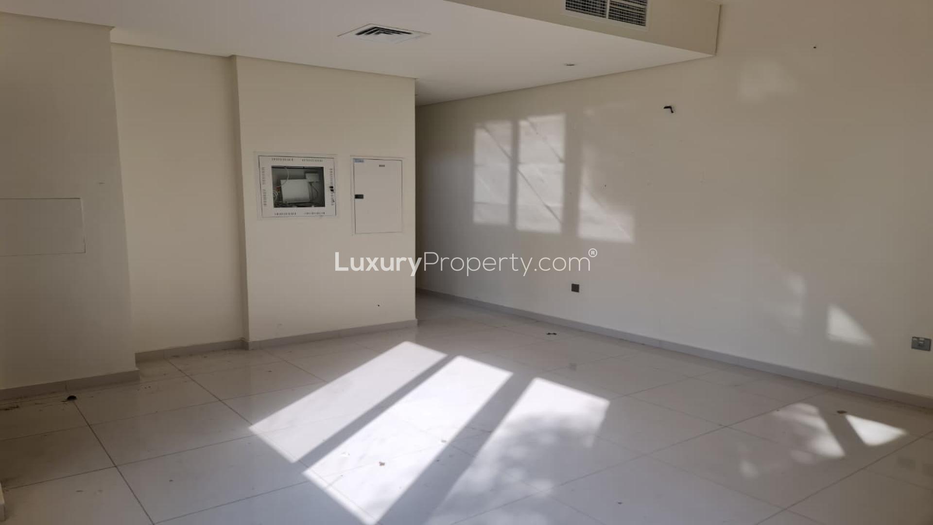 Empty bedroom with large window in Adria Villas, Damac Hills 2, for rent