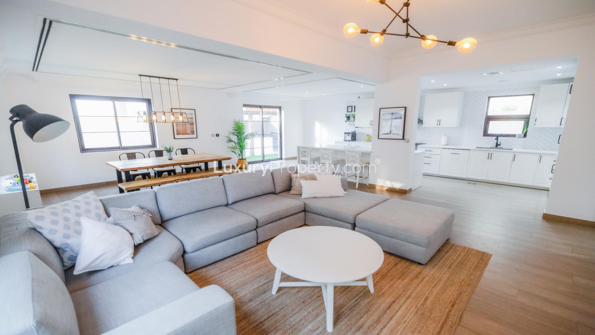 Luxurious villa exterior in Casa, Arabian Ranches 2, with garden and garage view