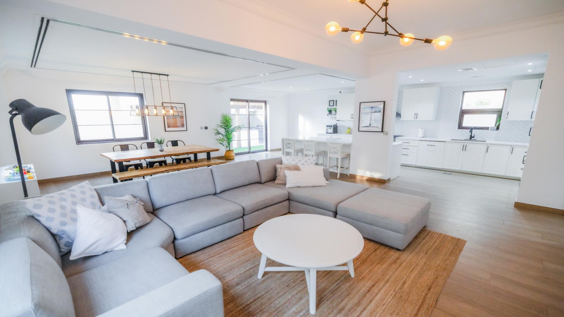 Luxurious villa exterior in Casa, Arabian Ranches 2, with garden and garage view