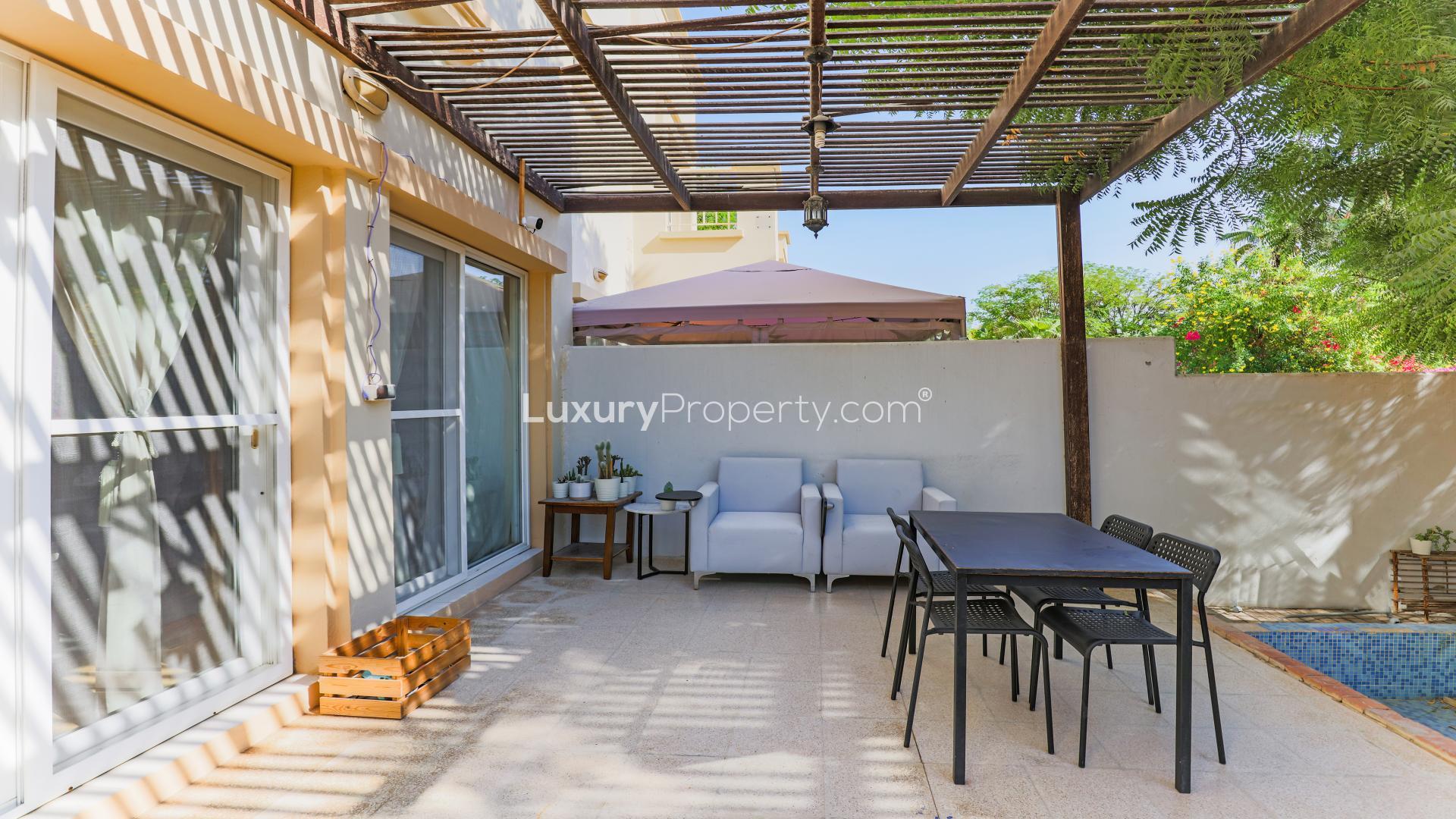 Lovely 3-bedroom villa garden view in Springs 14, lush greenery and outdoor seating area