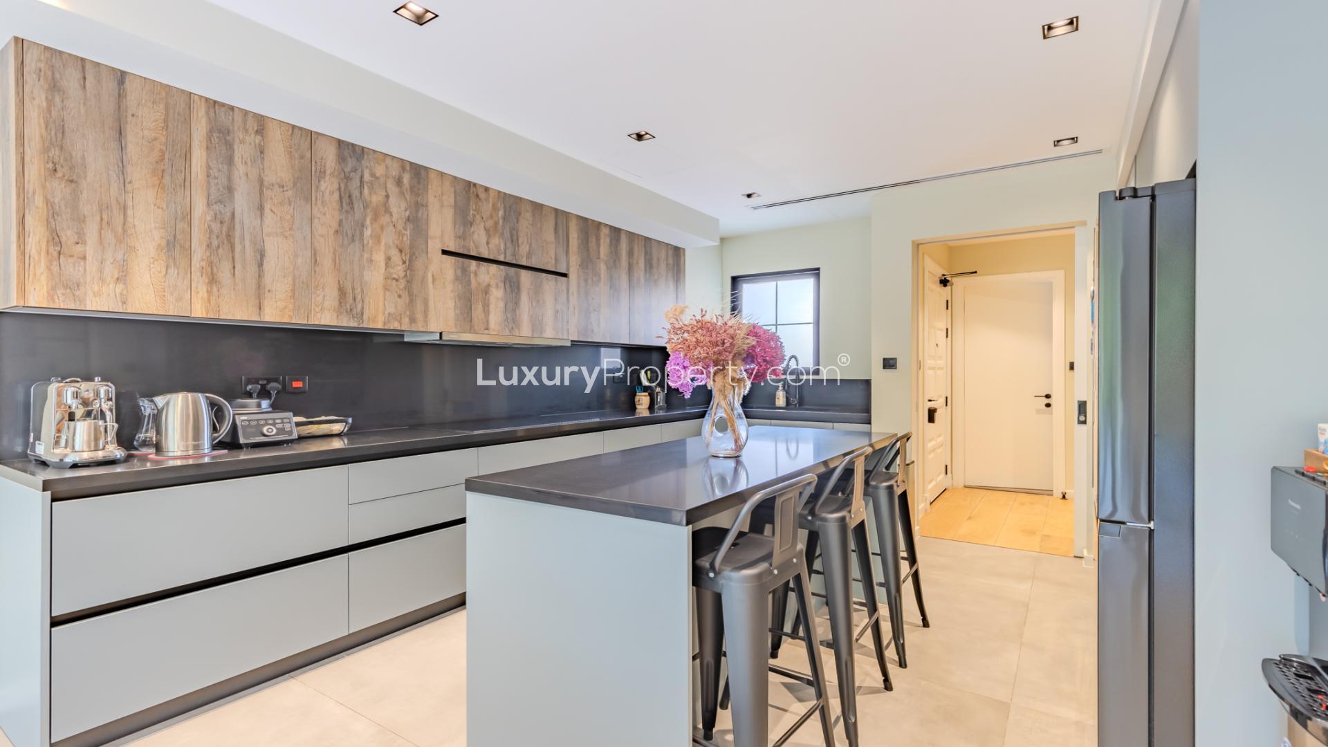 Modern living room in upgraded villa, The Springs 15, open layout with garden view