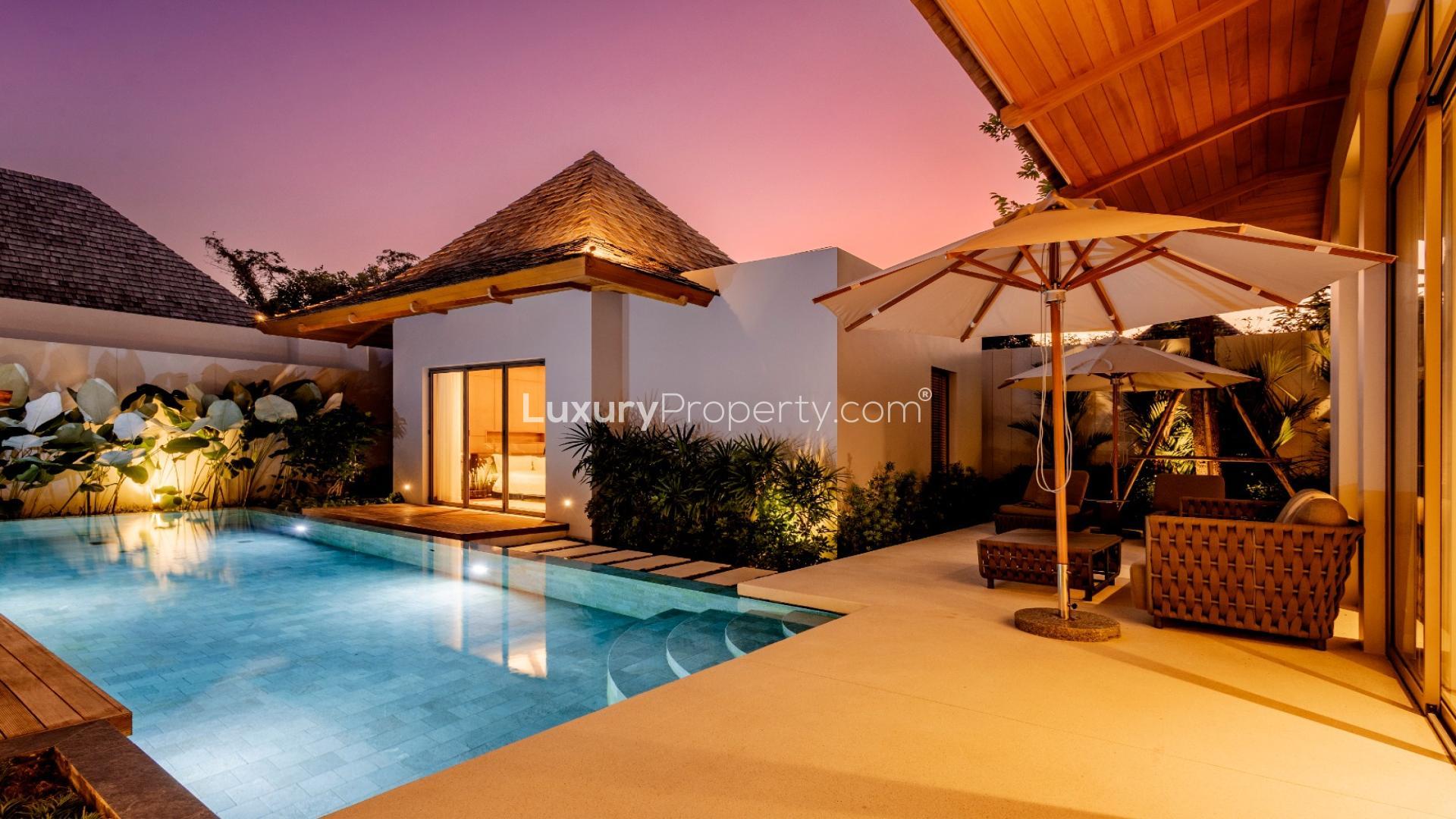 Luxurious villa with pool at Anchan Flora, Bang Tao Phuket, Thailand, evening view