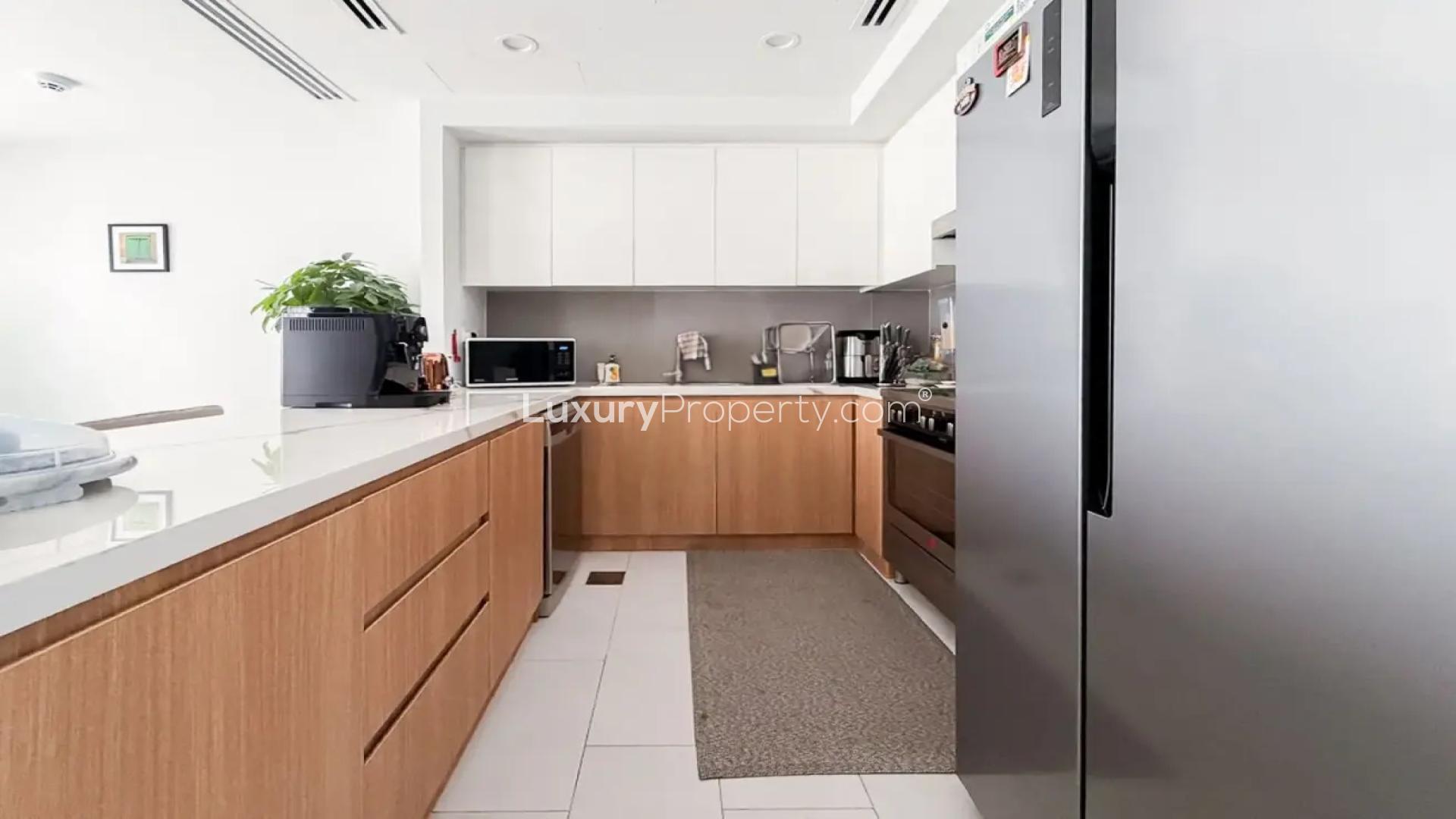 Modern open-plan kitchen and living area in Villanova La Rosa 6 villa for sale