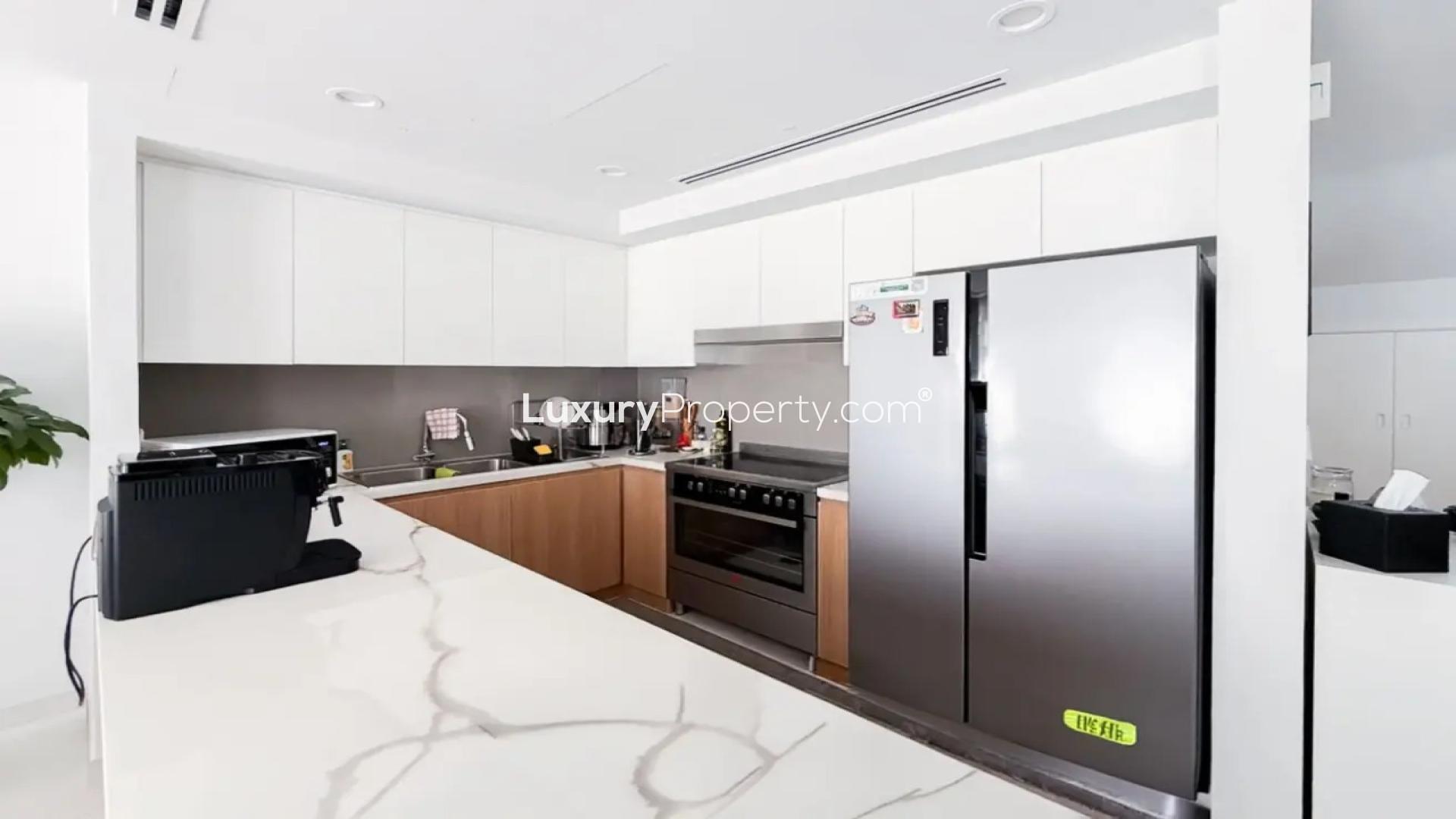 Modern kitchen in La Rosa 6 villa, Villanova, with sleek appliances and wooden cabinets
