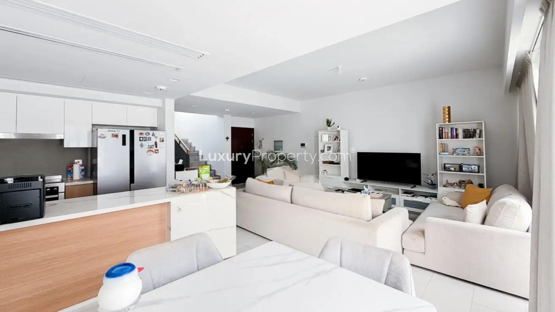 Modern open-plan living area in La Rosa 6 villa, Villanova, for sale