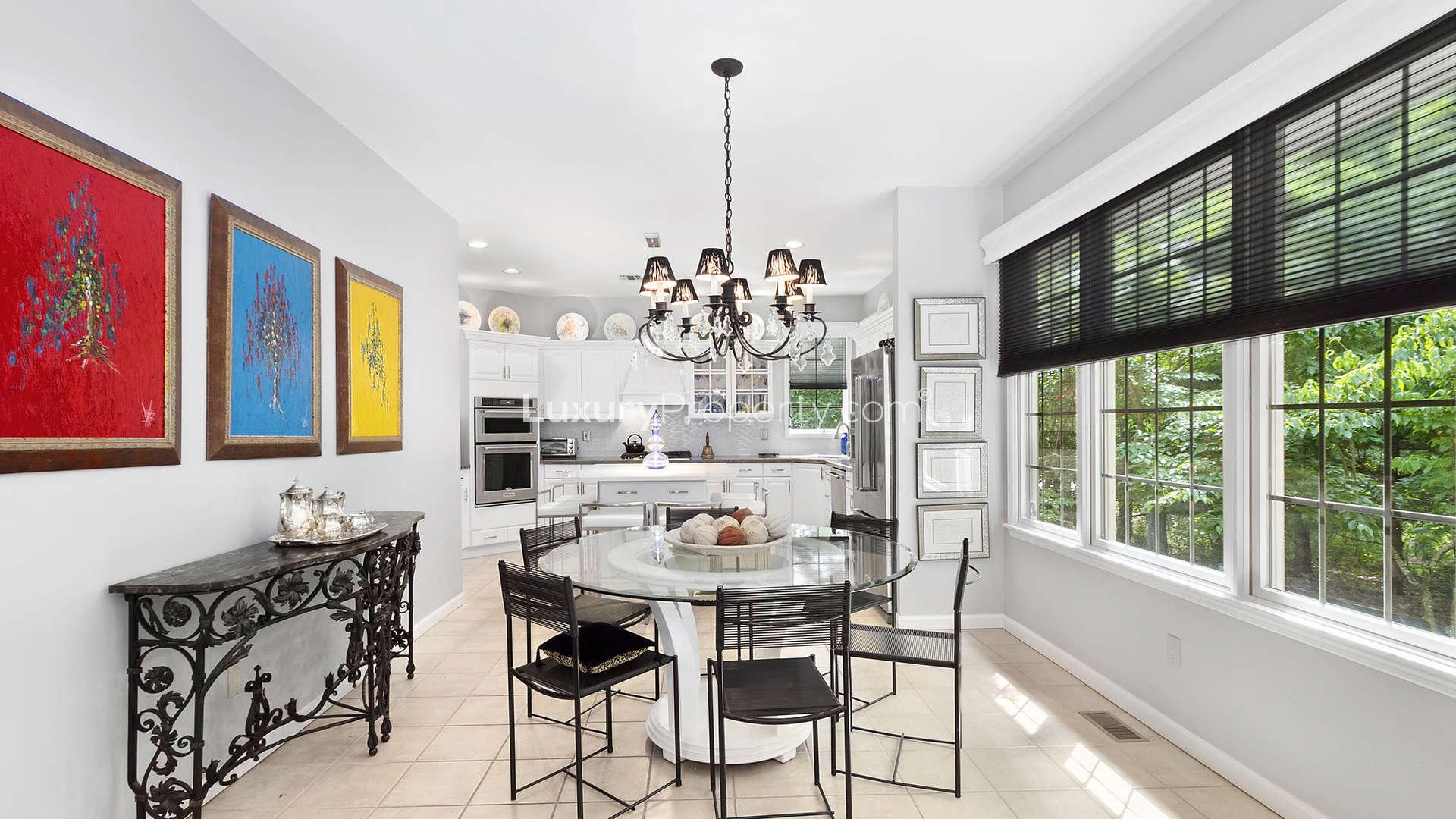 Charming living room with fireplace in Sag Harbor villa, featuring elegant decor and large windows