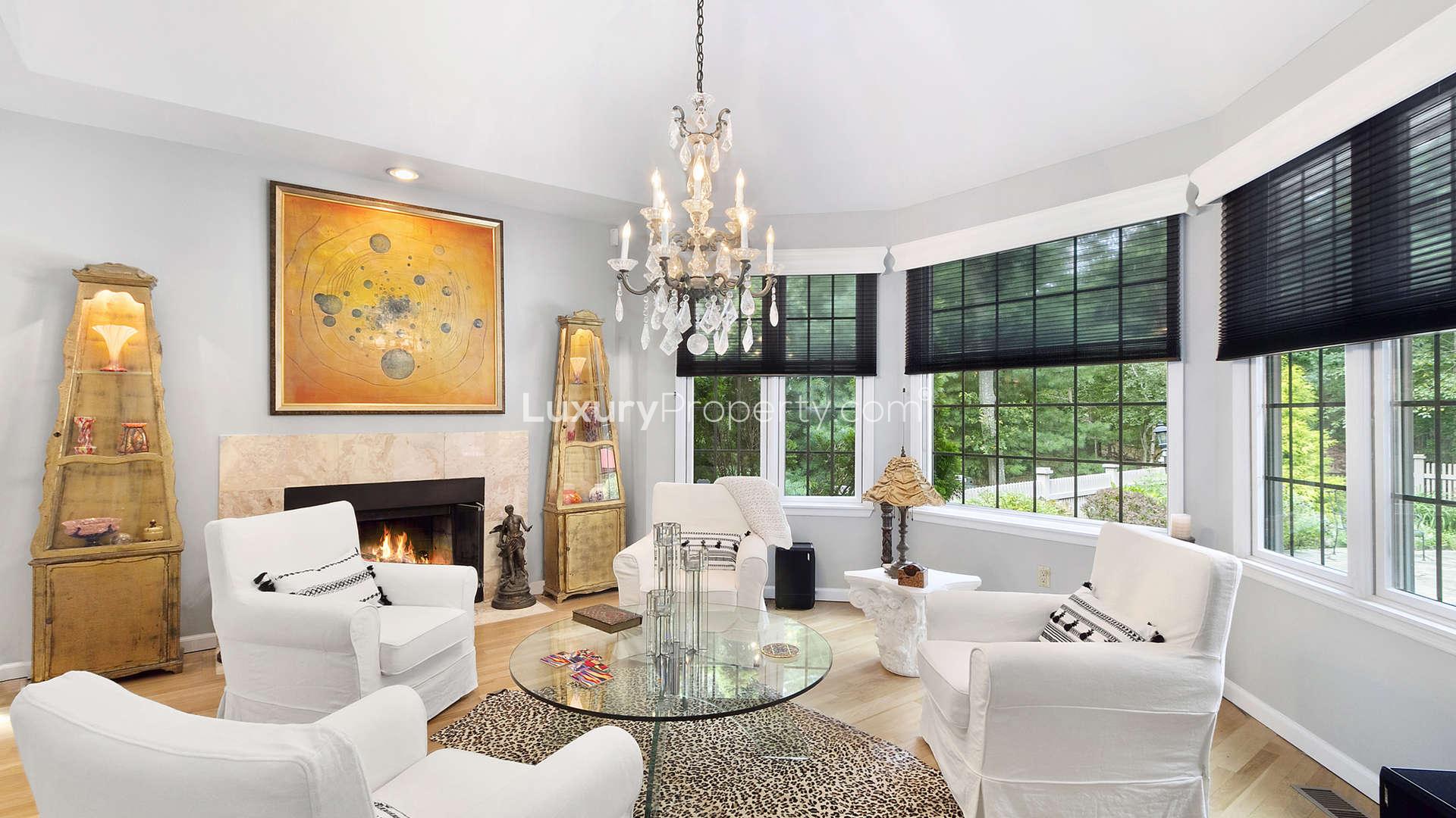 Living room with cozy fireplace in Sag Harbor ranch-style villa for sale