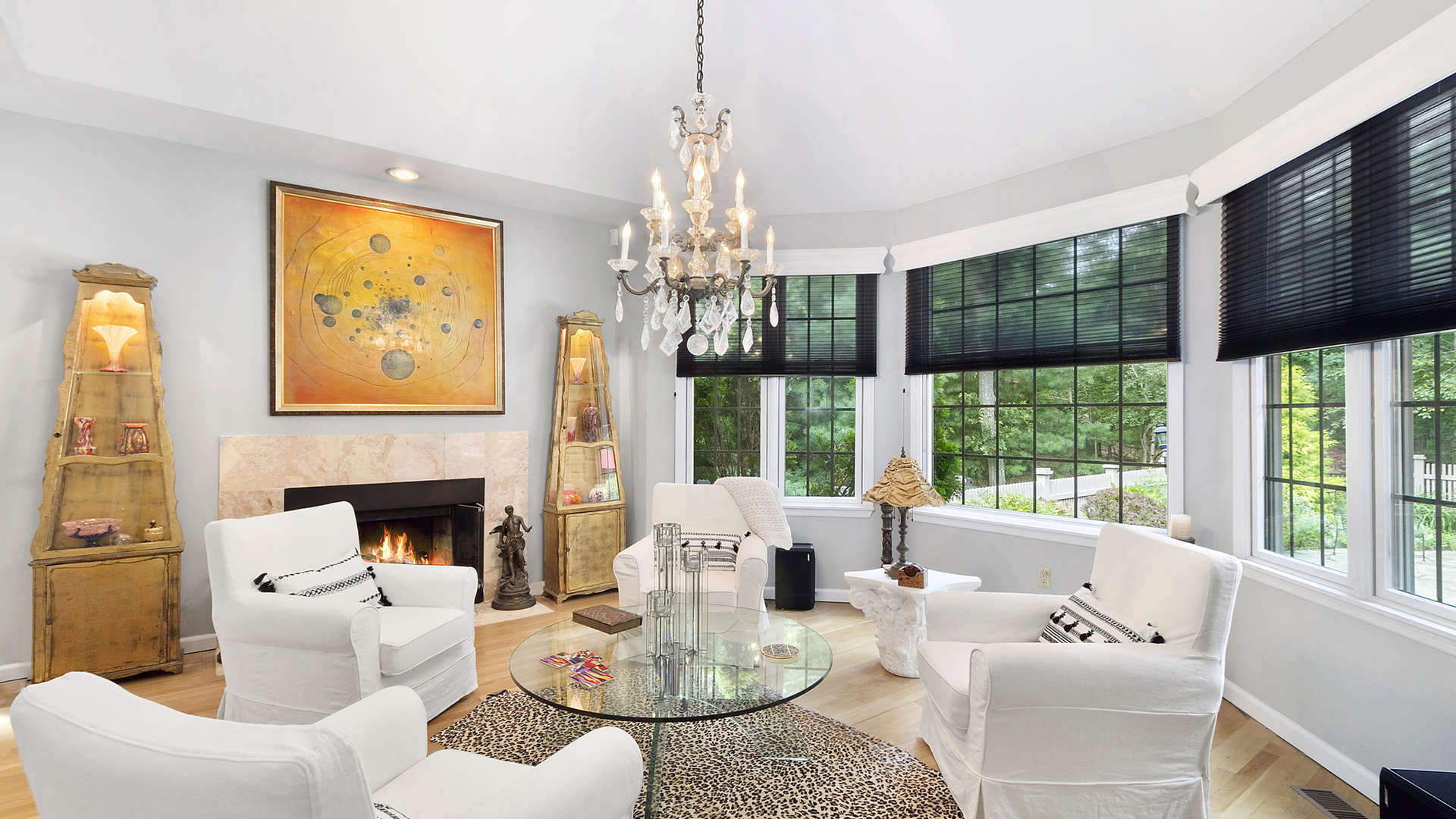 Living room with cozy fireplace in Sag Harbor ranch-style villa for sale