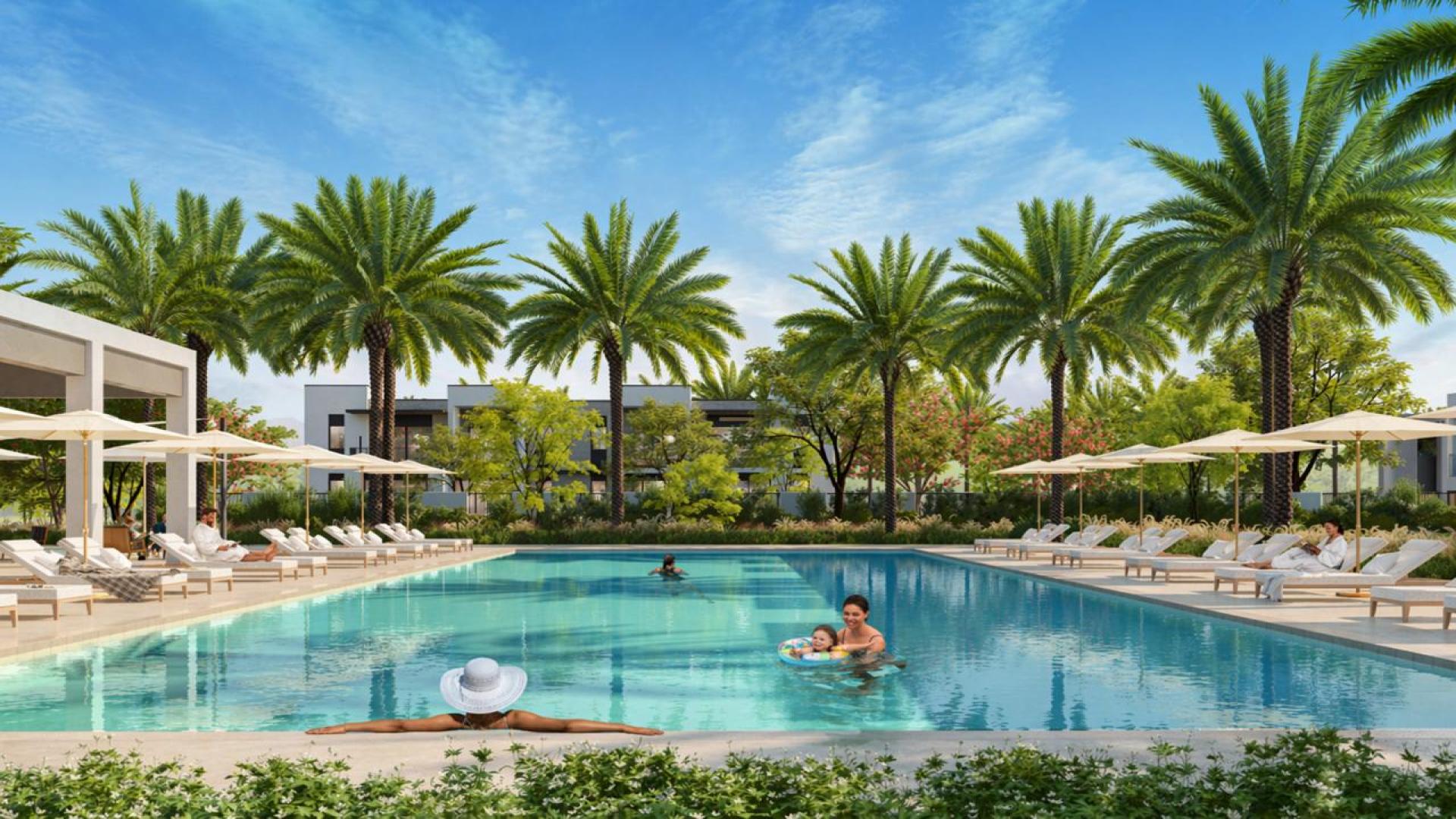 Modern villa exterior in Anya 2, Arabian Ranches 3, with lush landscaping and palm trees