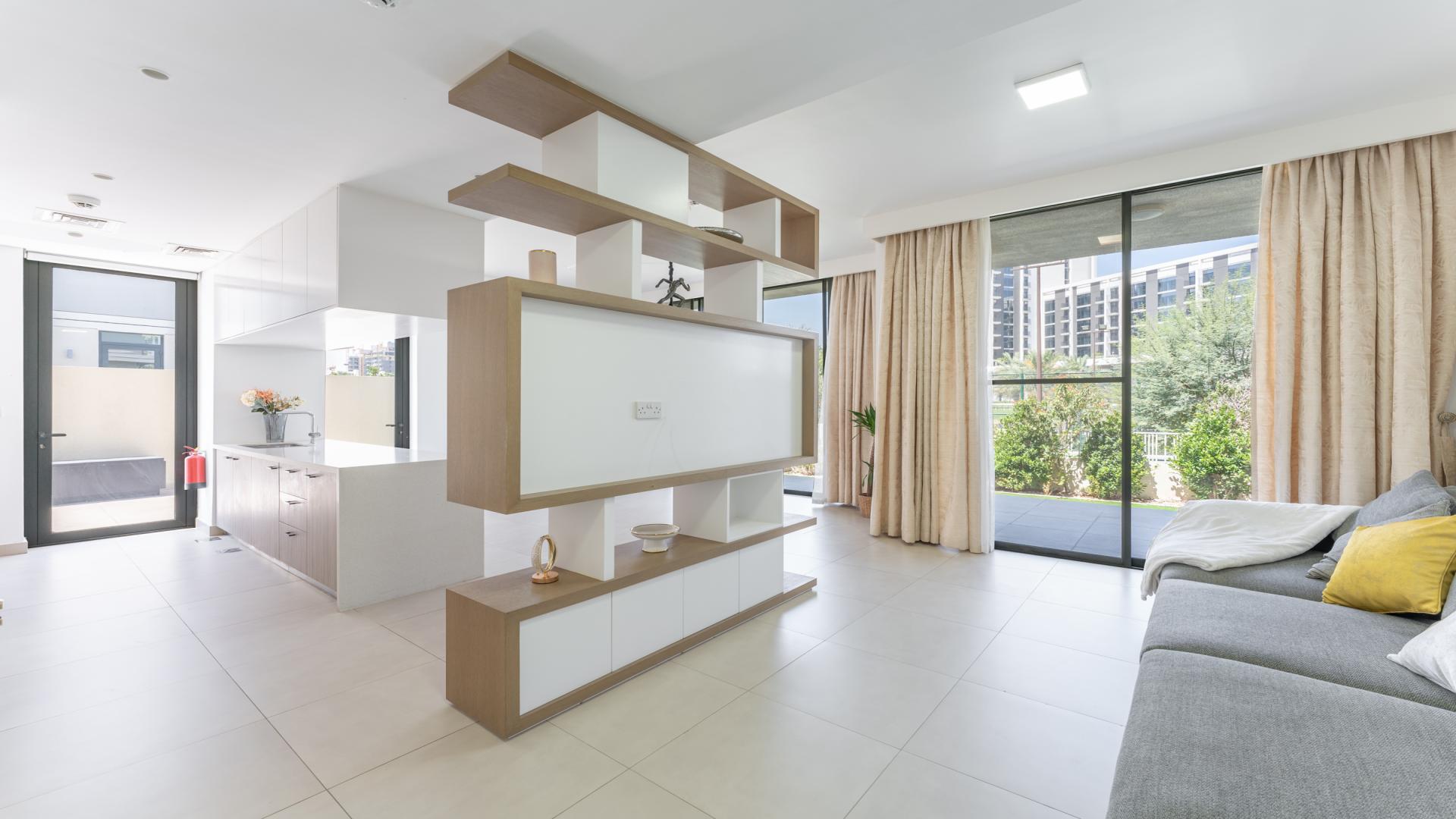 Modern living room in 3-bedroom villa, Club Villas Dubai Hills, with park views