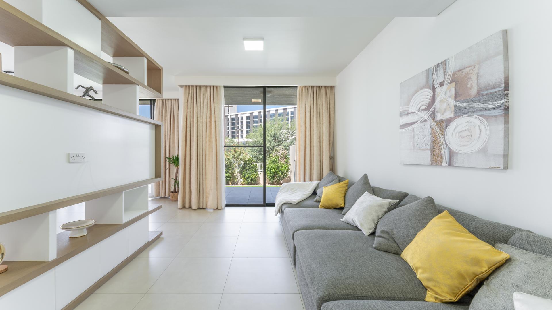 Luxury 3-bedroom villa exterior in Club Villas, Dubai Hills Estate with green lawn