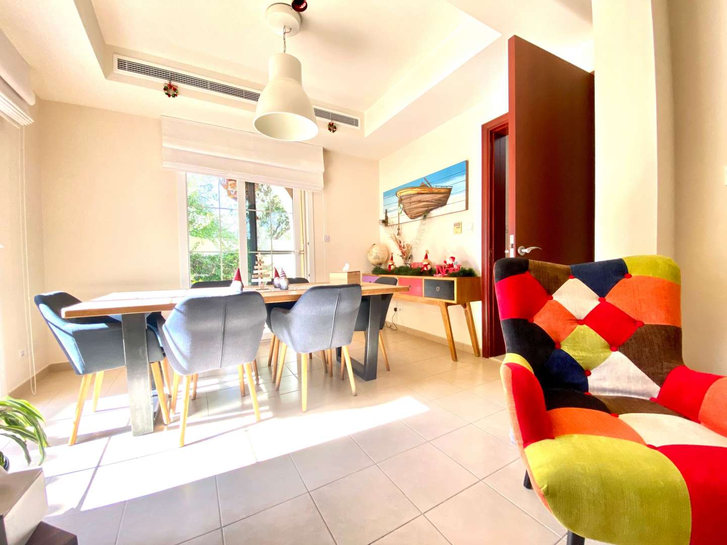 Modern kitchen in 3-bedroom villa, Alma, Arabian Ranches, featuring wooden cabinets and island