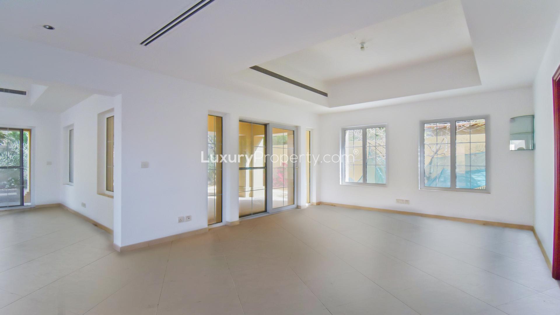 Bright living room in Alvorada Type A1 villa, Arabian Ranches, featuring large windows