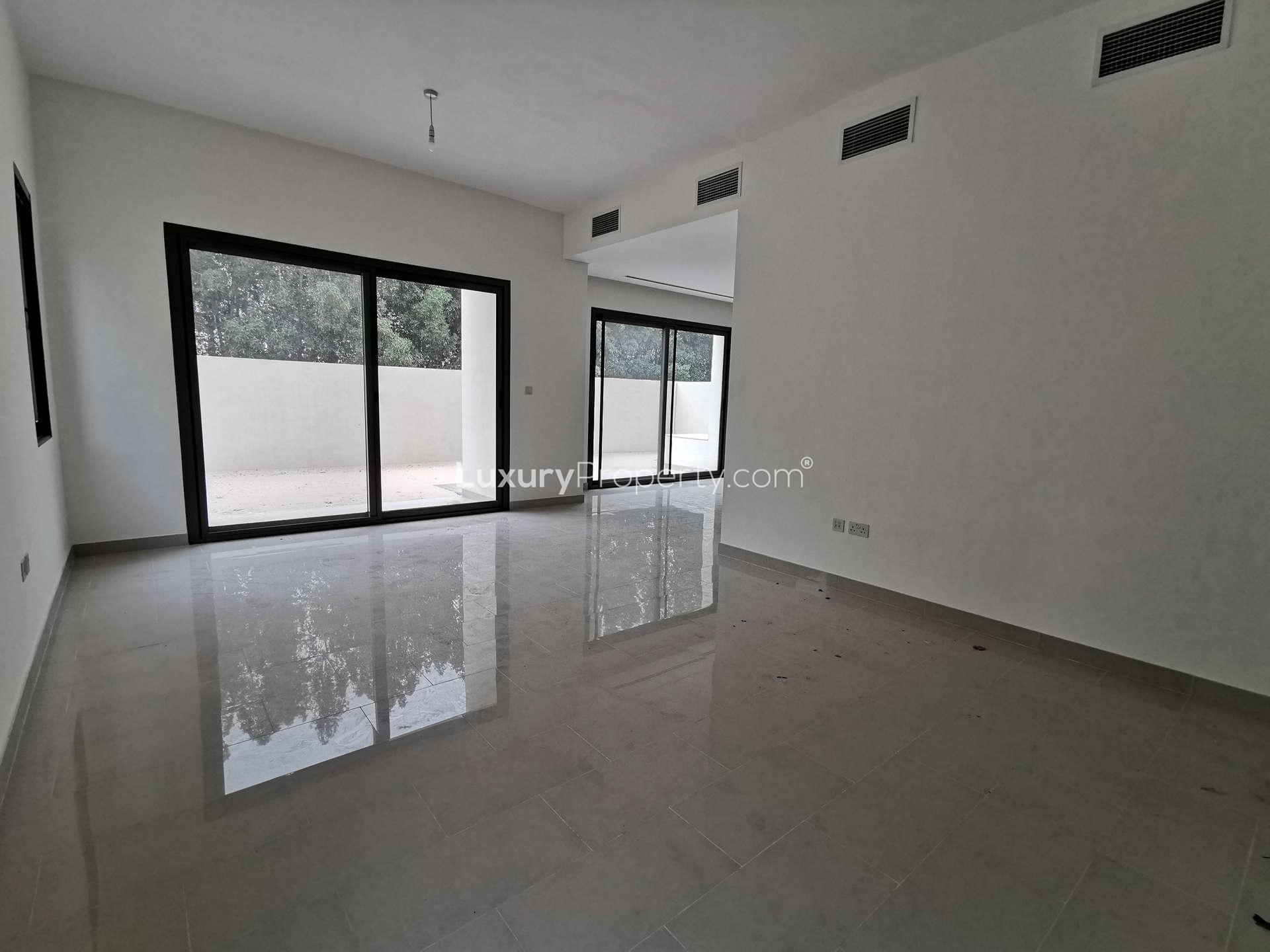 Modern bedroom with tiled floor and built-in wardrobe in Azalea Villa, Arabian Ranches 2