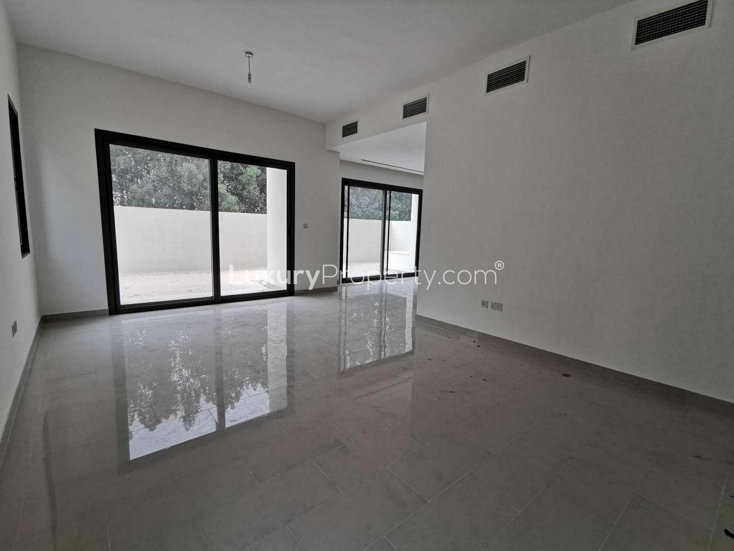 Modern kitchen and living area in 3-bedroom villa, Azalea, Arabian Ranches 2