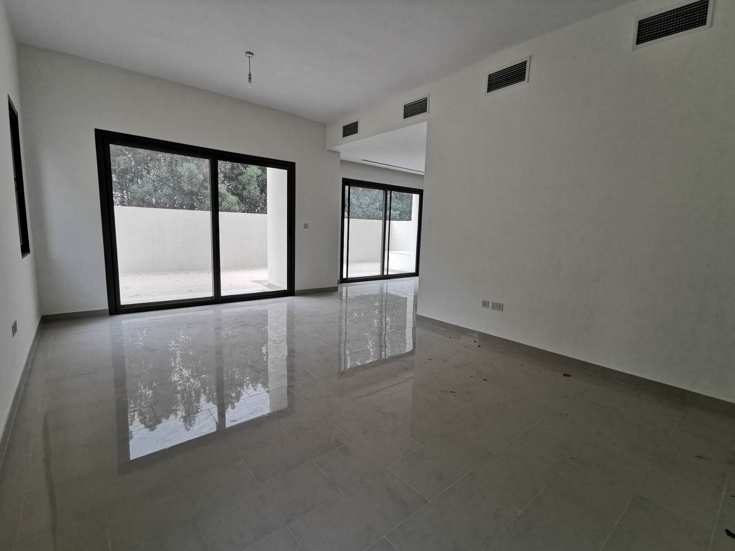 Modern kitchen and living area in 3-bedroom villa, Azalea, Arabian Ranches 2