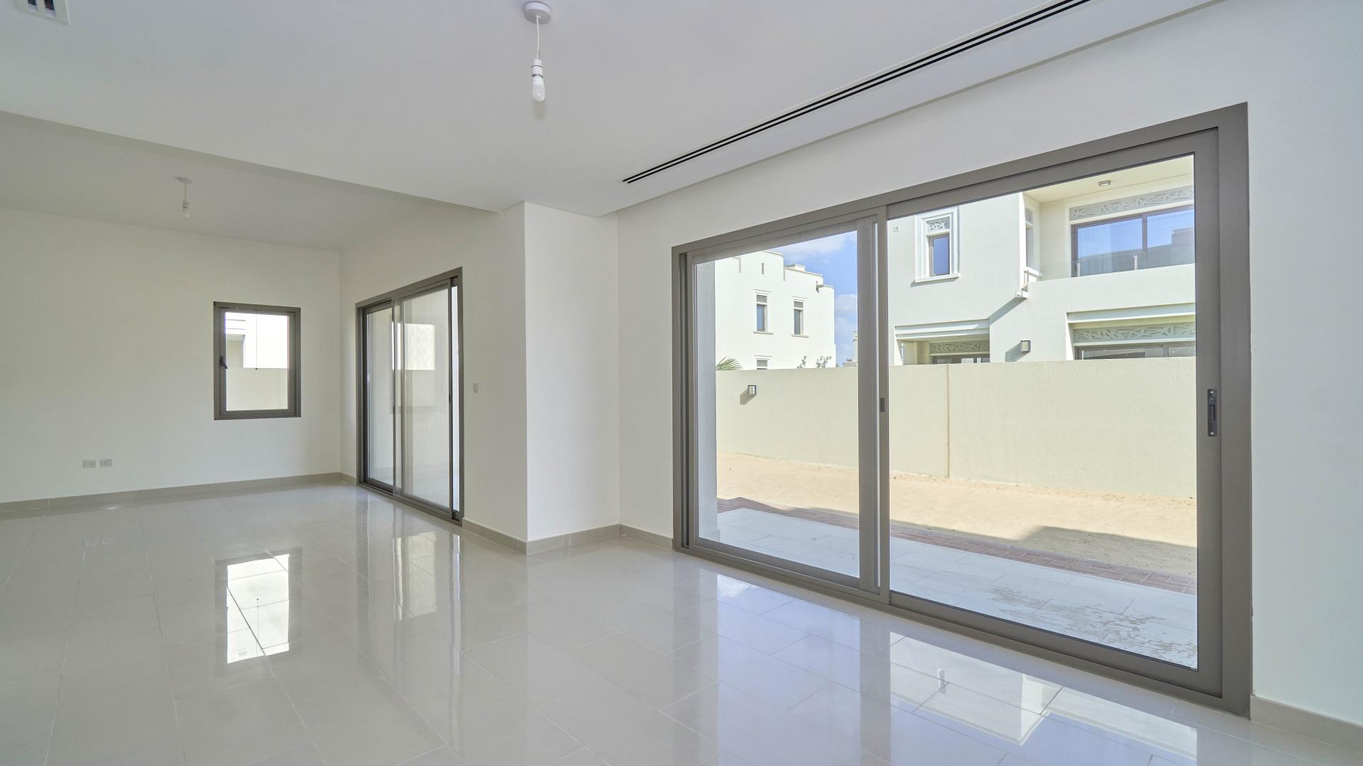 Bright living room with large windows in Azalea villa, Arabian Ranches 2