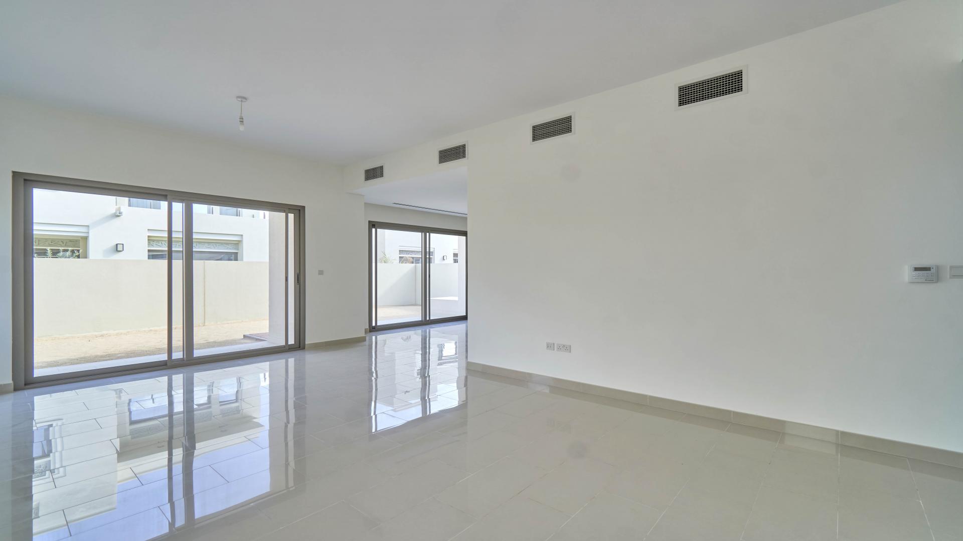 Empty living room with large windows in Azalea villa, Arabian Ranches 2