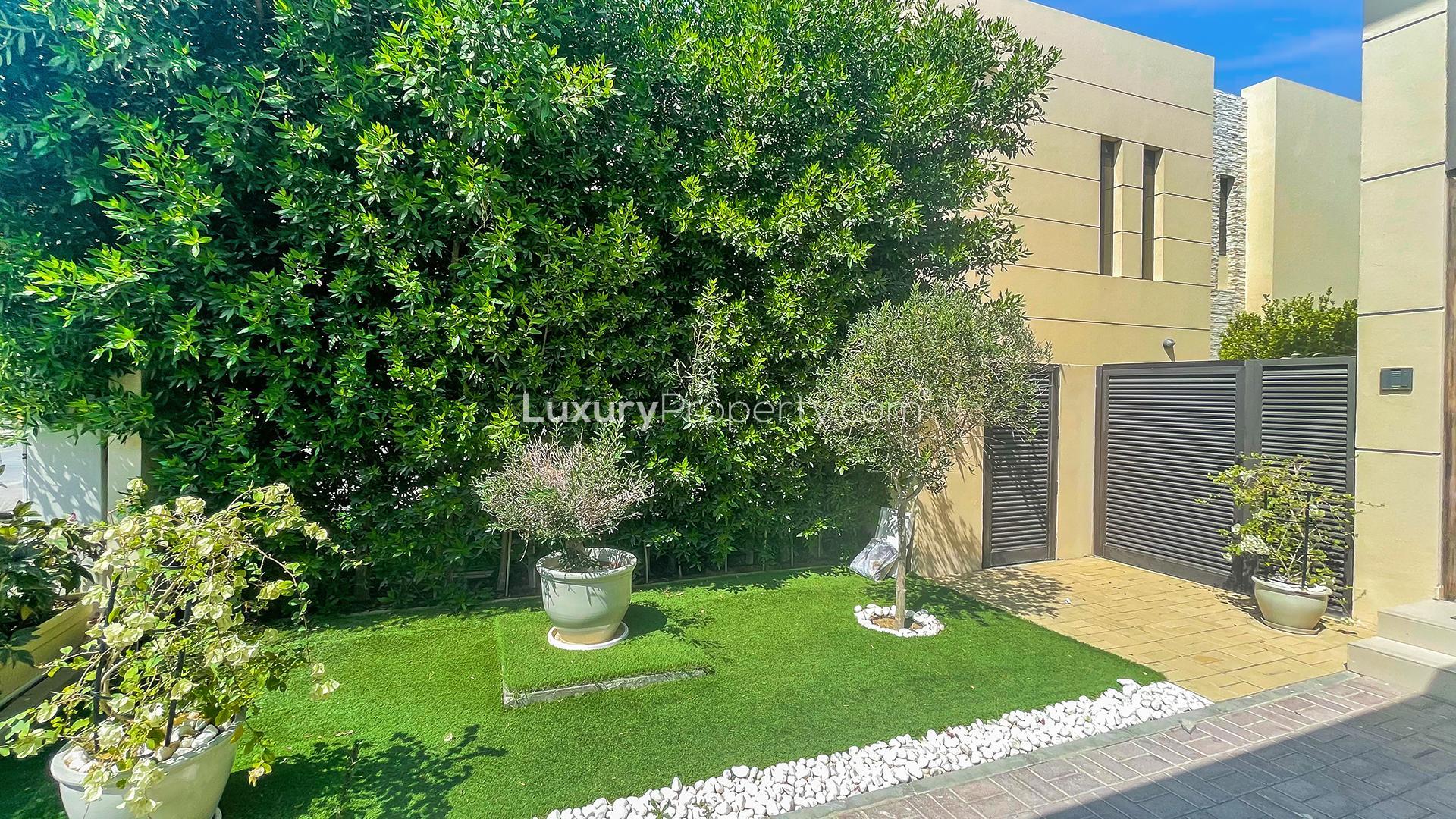 Spacious living room in 3-bedroom villa, Brookfield, Damac Hills, modern decor and dining area