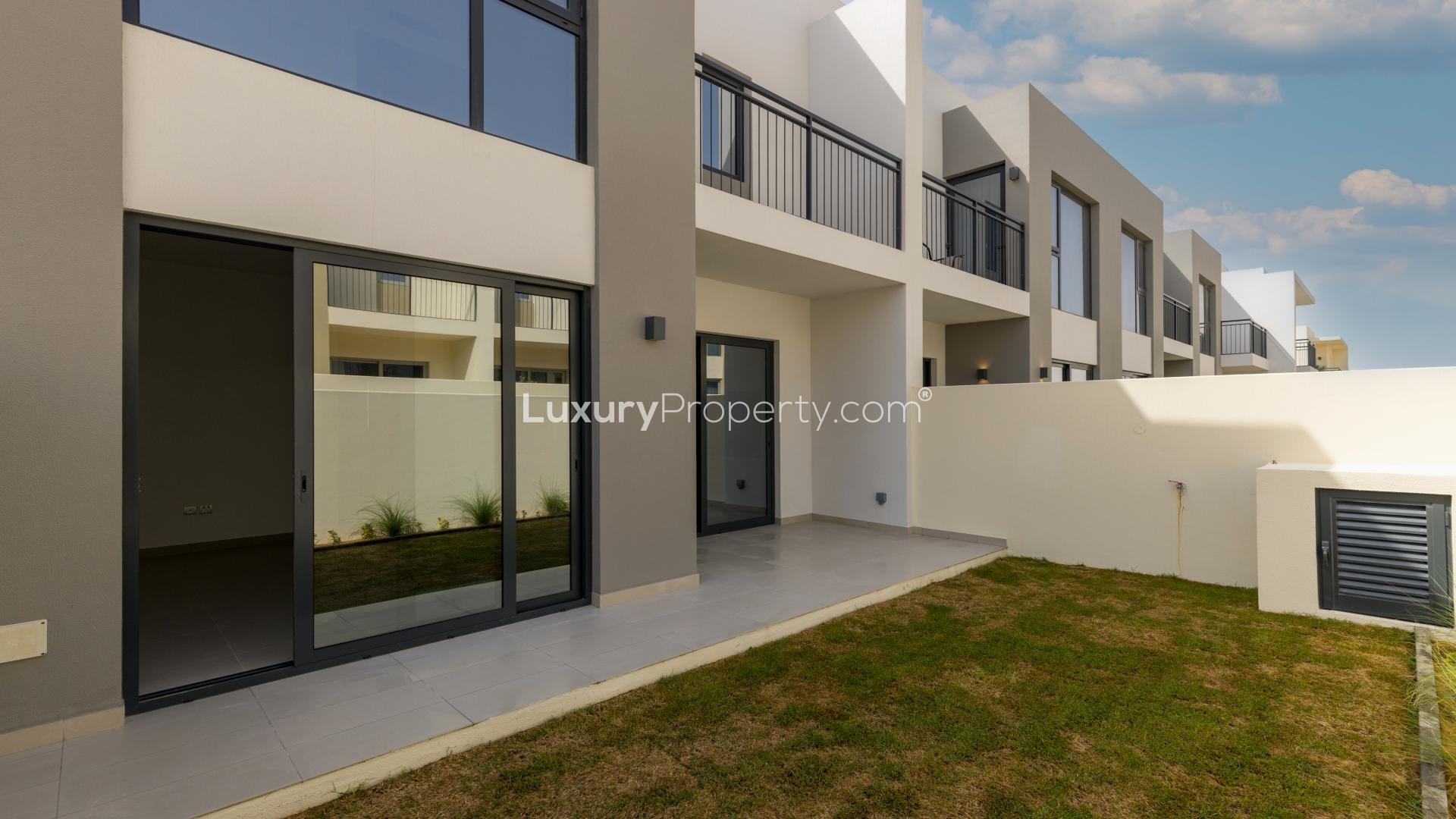 Bright living area with large windows in Camelia villa, Arabian Ranches 2