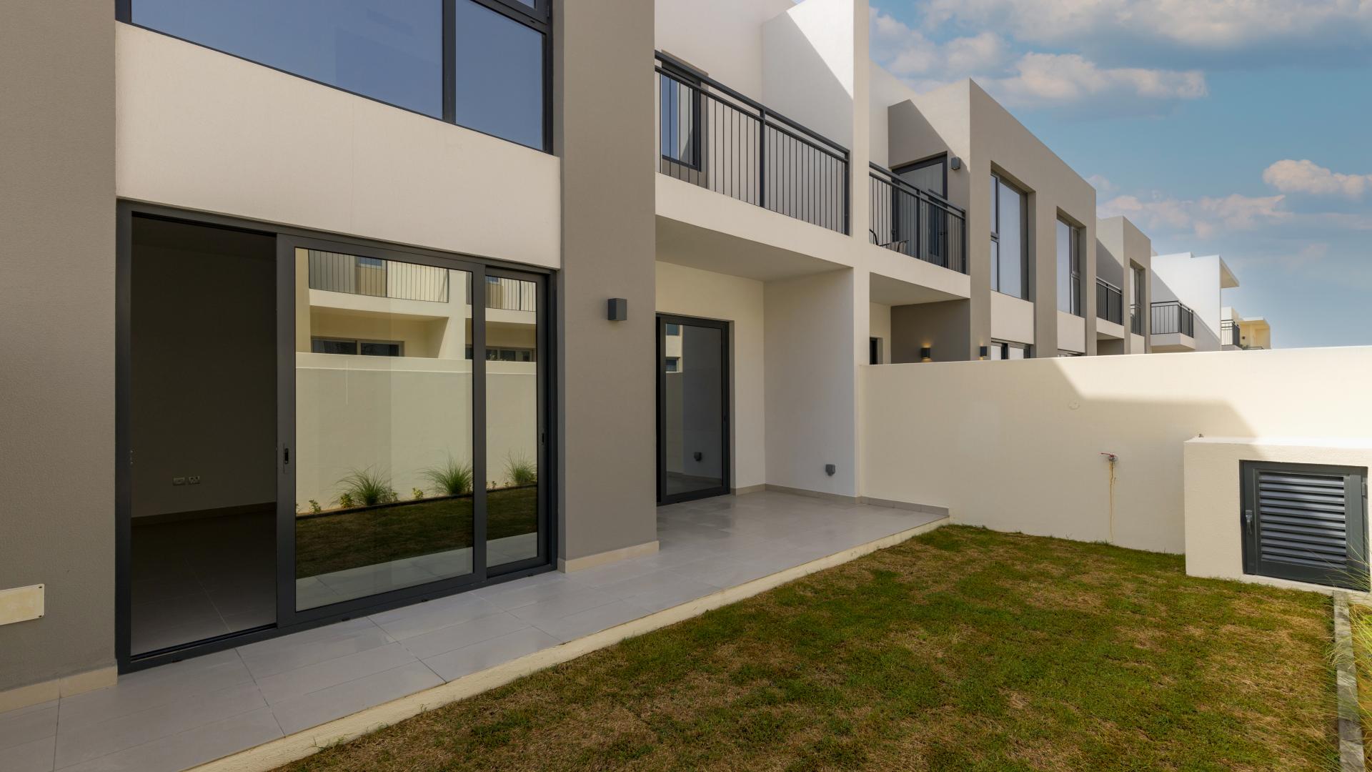 Bright living area with large windows in Camelia villa, Arabian Ranches 2