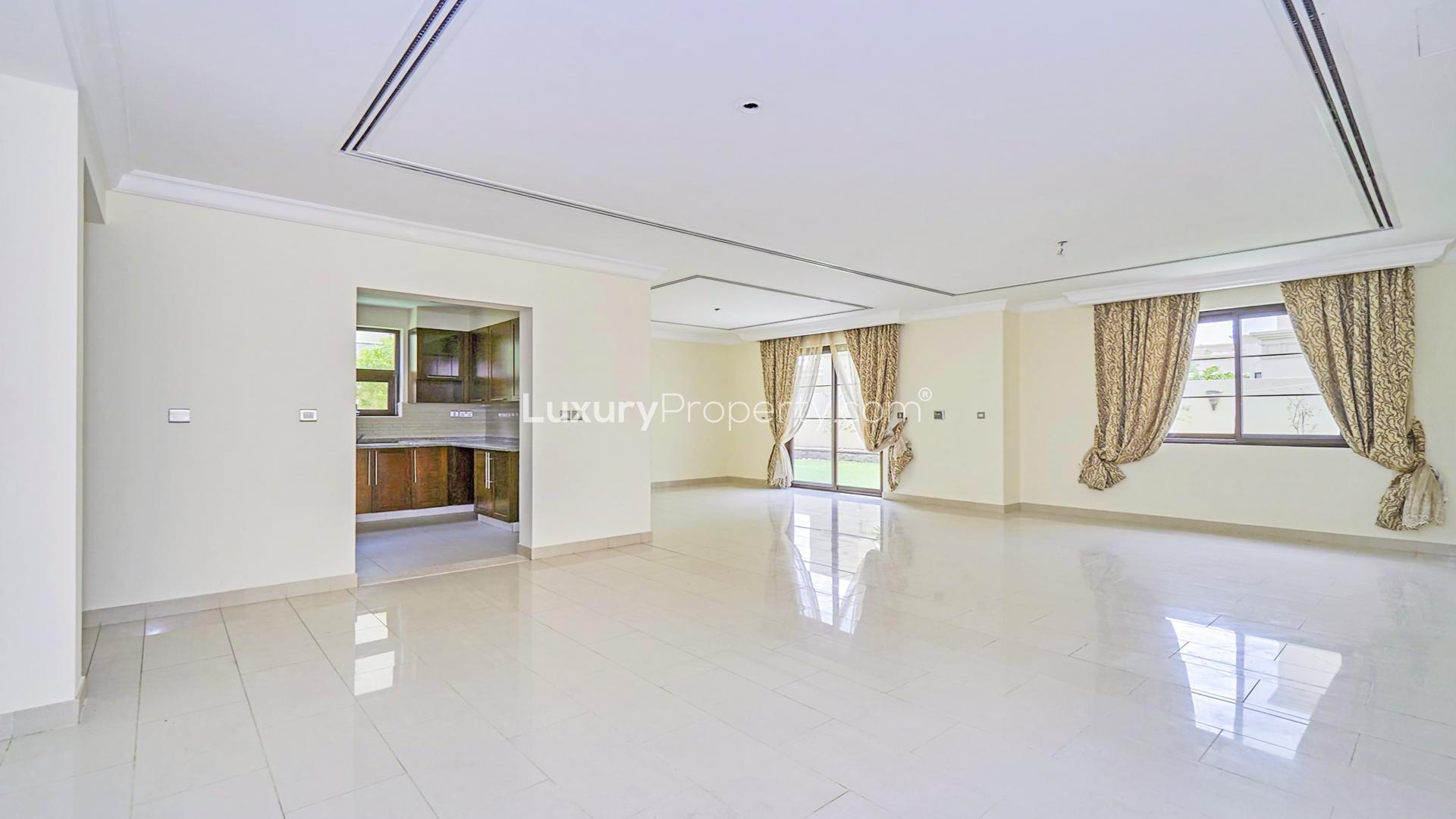 Elegant 3-bedroom villa exterior in Casa, Arabian Ranches 2, with lush greenery