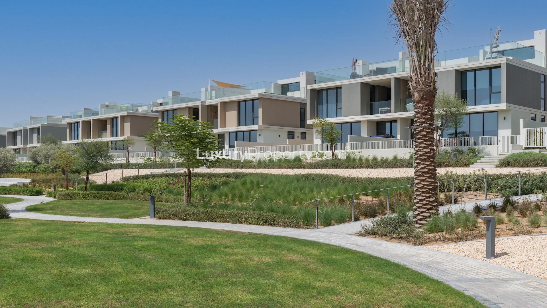 Modern 3-bedroom villa exterior in Club Villas, Dubai Hills Estate, lush landscaped surroundings