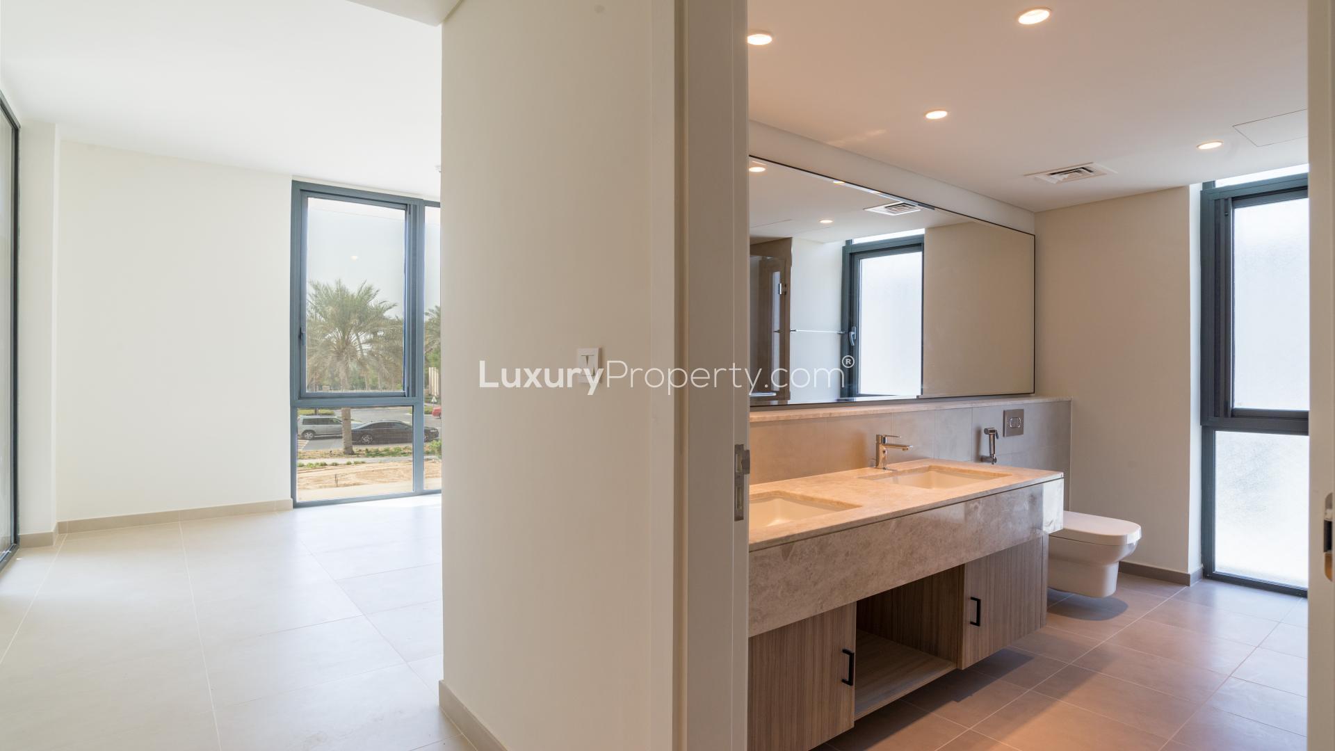 "Spacious hallway in 3-bedroom villa at Dubai Hills Estate with modern interior design.",Luxurious bathroom in 3-bedroom villa, Club Villas, Dubai Hills Estate, natural light, modern design