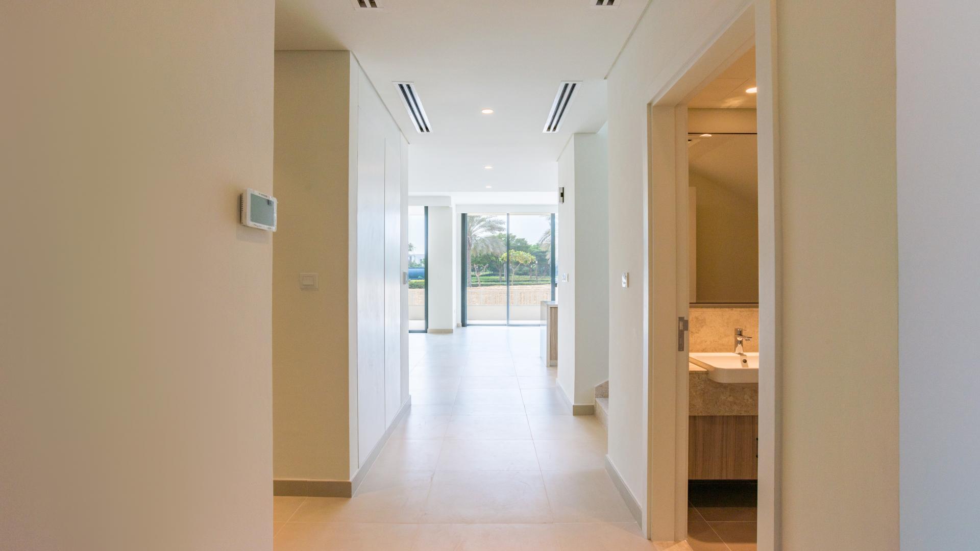 Modern kitchen and spacious living area in Dubai Hills Estate villa for sale