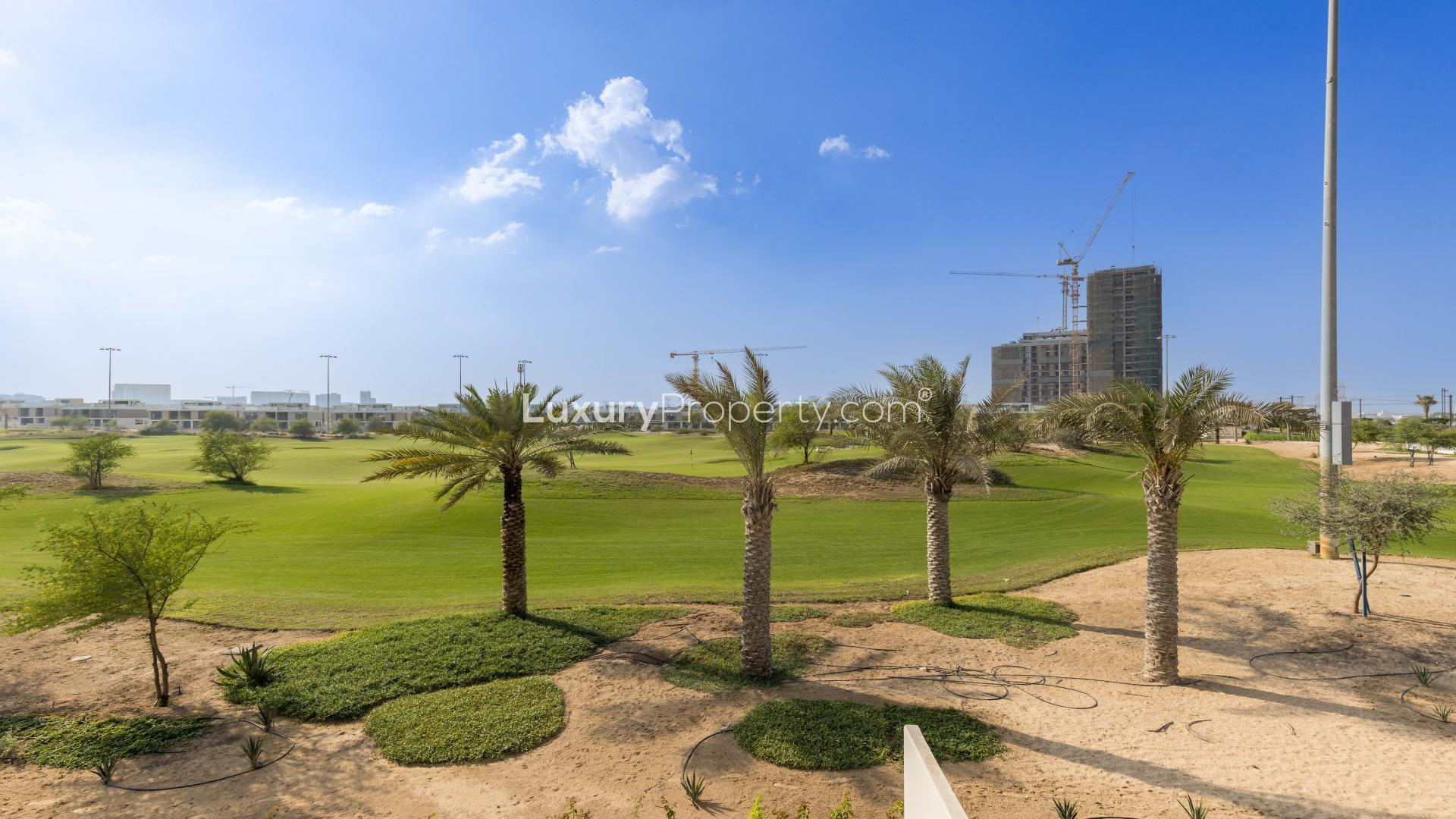Corner unit villa interior with large windows overlooking golf course at Dubai Hills Estate