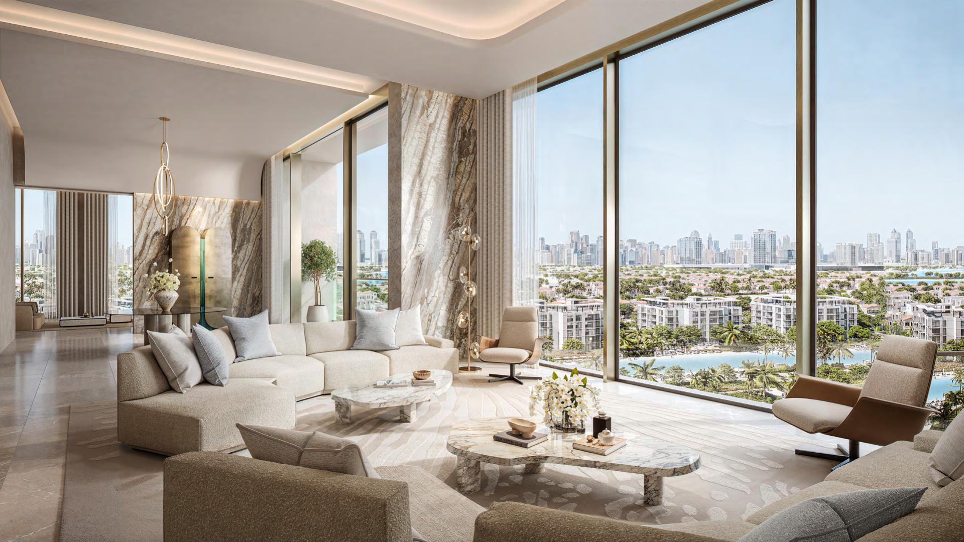 Luxurious living room in District One Naya Residences 3-bedroom villa, open kitchen view