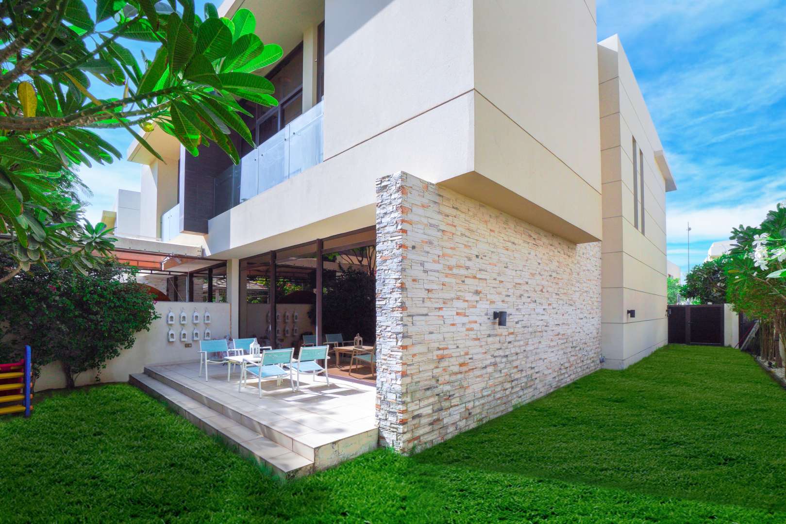 Elegant 3-bedroom villa exterior with patio in The Flora, Damac Hills for sale