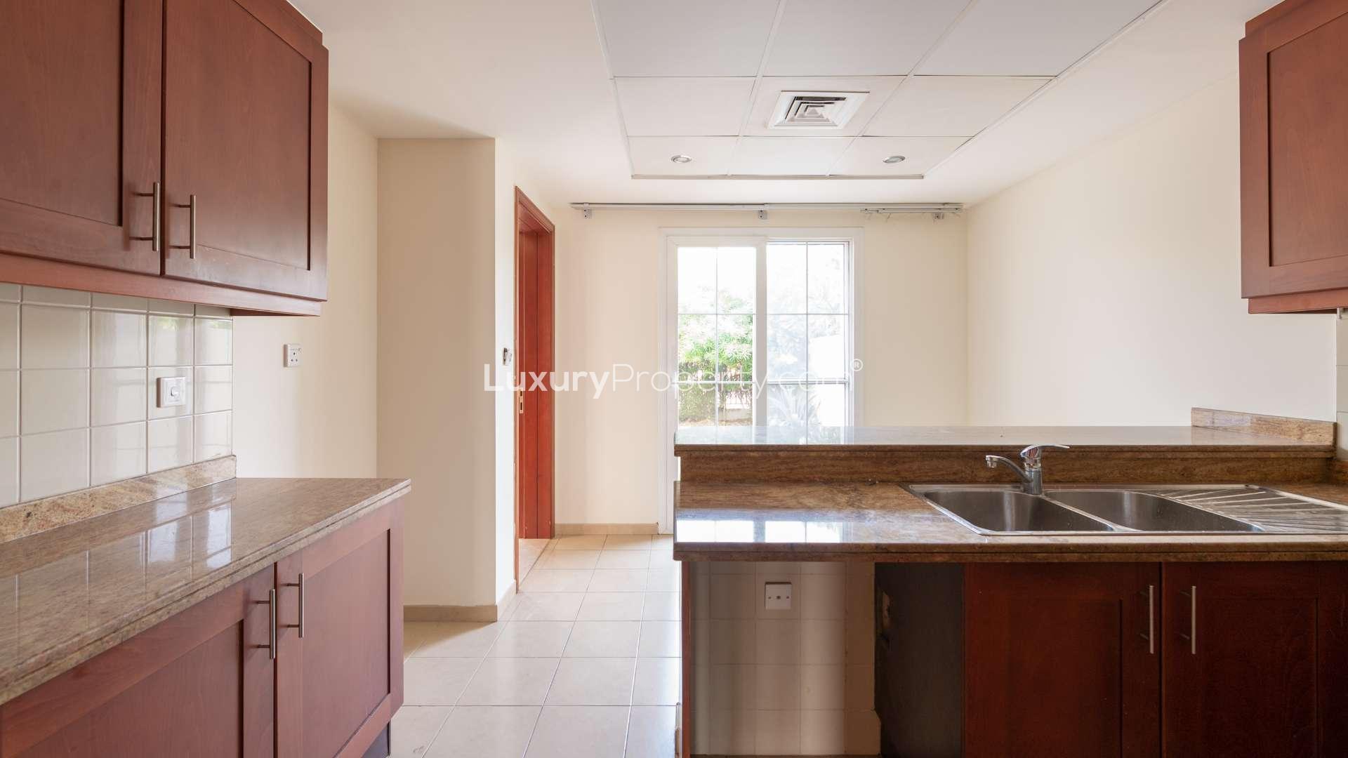 Balcony view of spacious corner villa in Ghadeer, The Lakes, with city skyline backdrop
