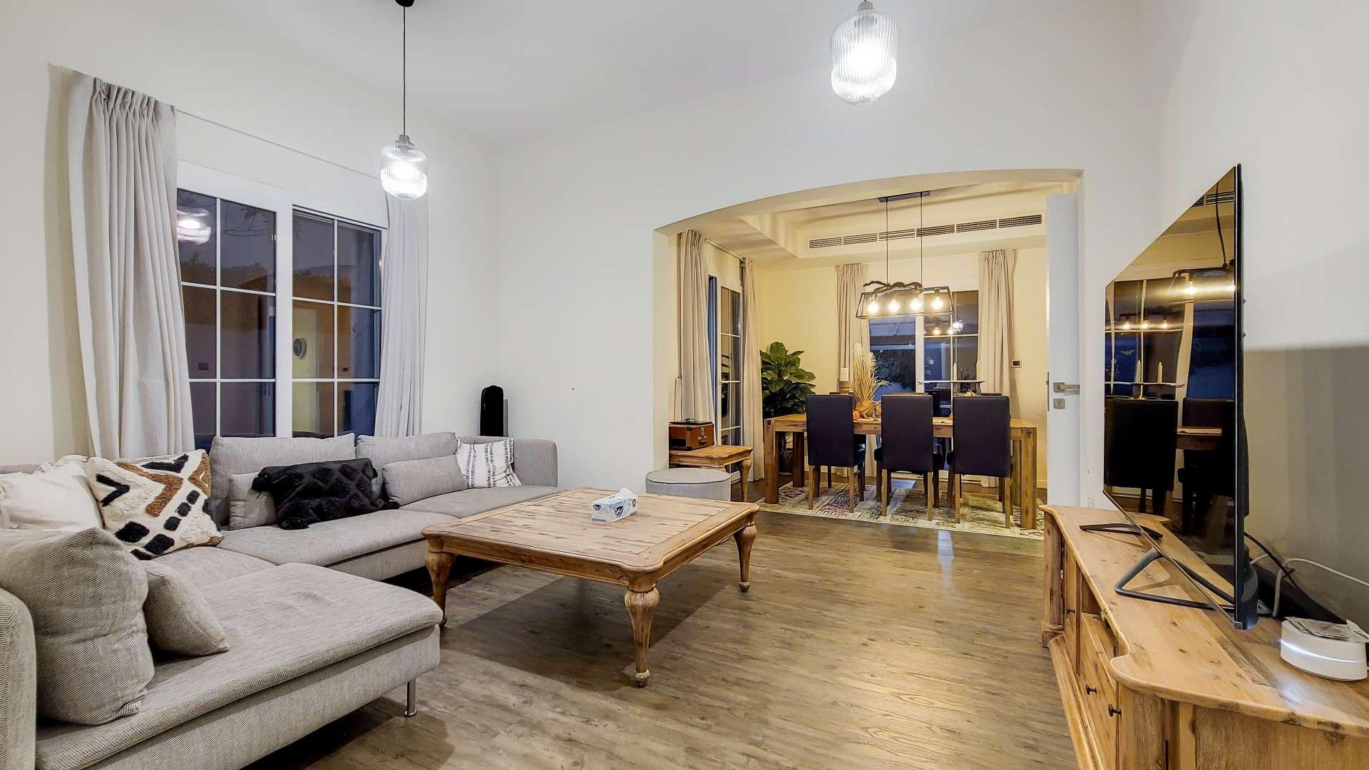 Upgraded single-row villa with spacious backyard in Ghadeer, The Lakes community for sale