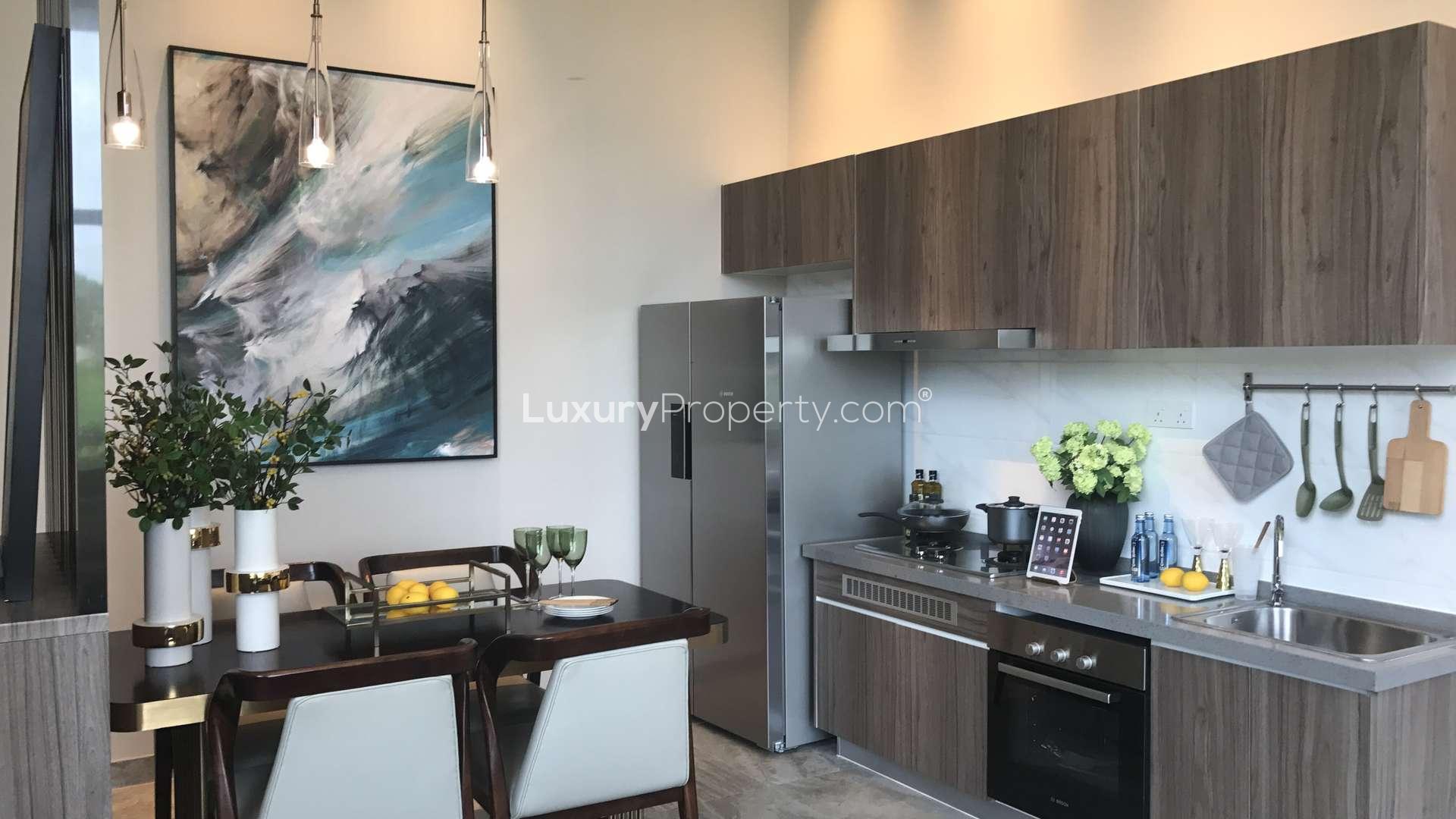 Luxurious living room in three-bedroom golf villa, Forest City, Malaysia, with garden view