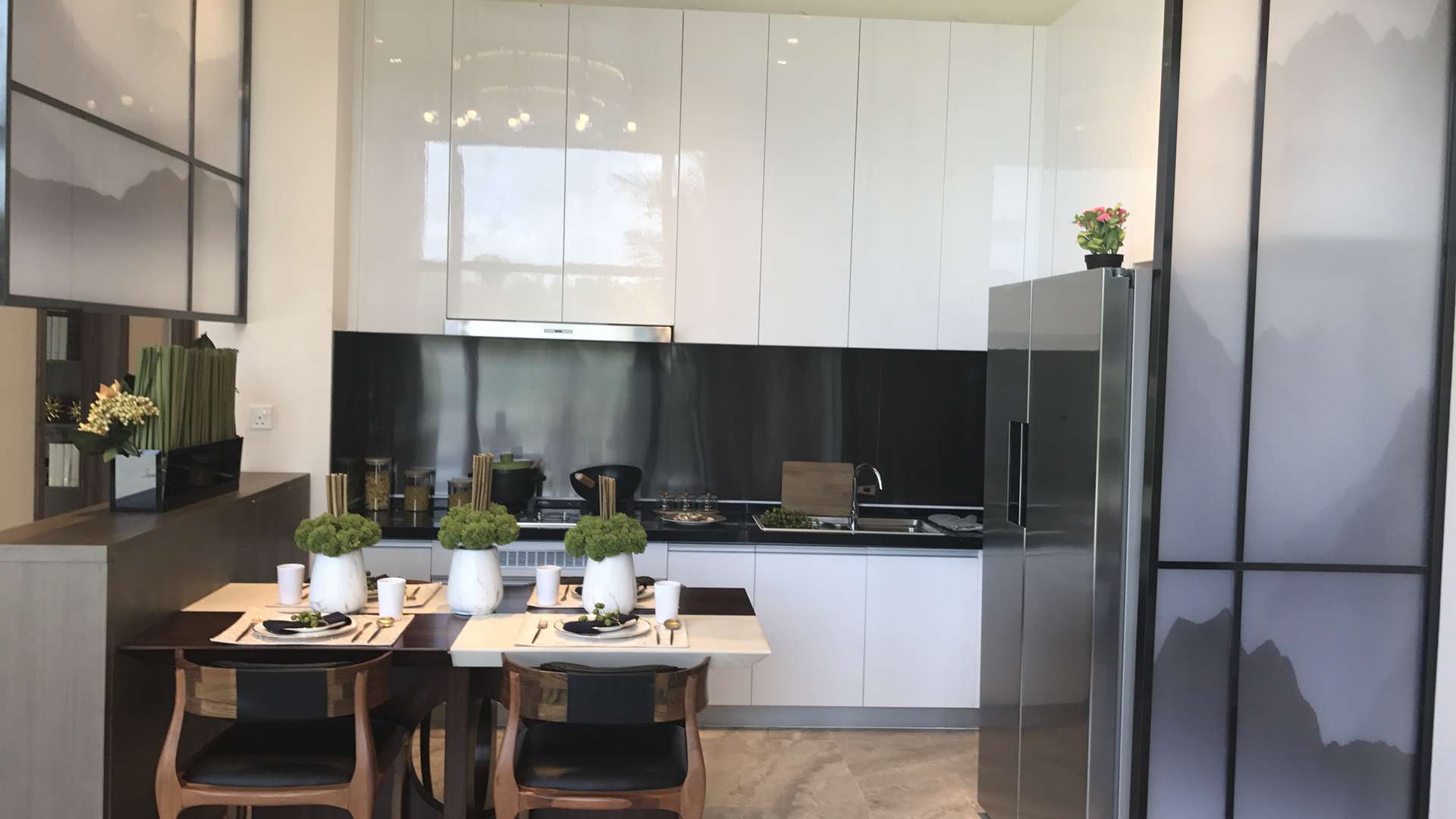 Modern kitchen in three-bedroom golf villa, Forest City, Malaysia, with stylish decor and appliances