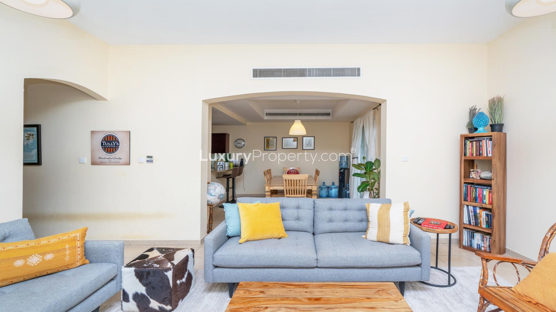 Balcony view from 3-bed villa in Al Reem, Arabian Ranches, showcasing lush greenery