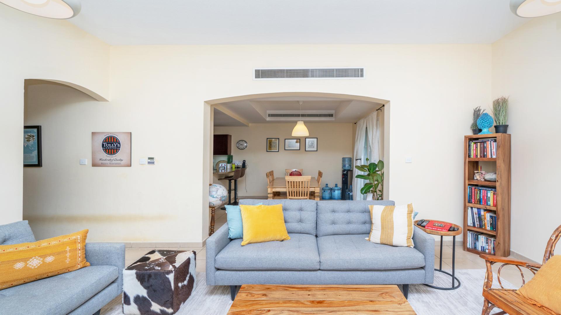 Balcony view from 3-bed villa in Al Reem, Arabian Ranches, showcasing lush greenery