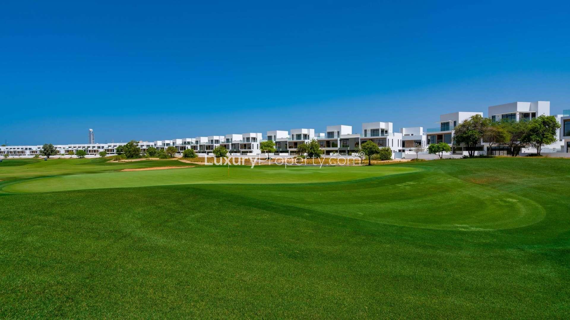 Garden townhouse view in Jumeirah Golf Estates, surrounded by lush greenery, for sale