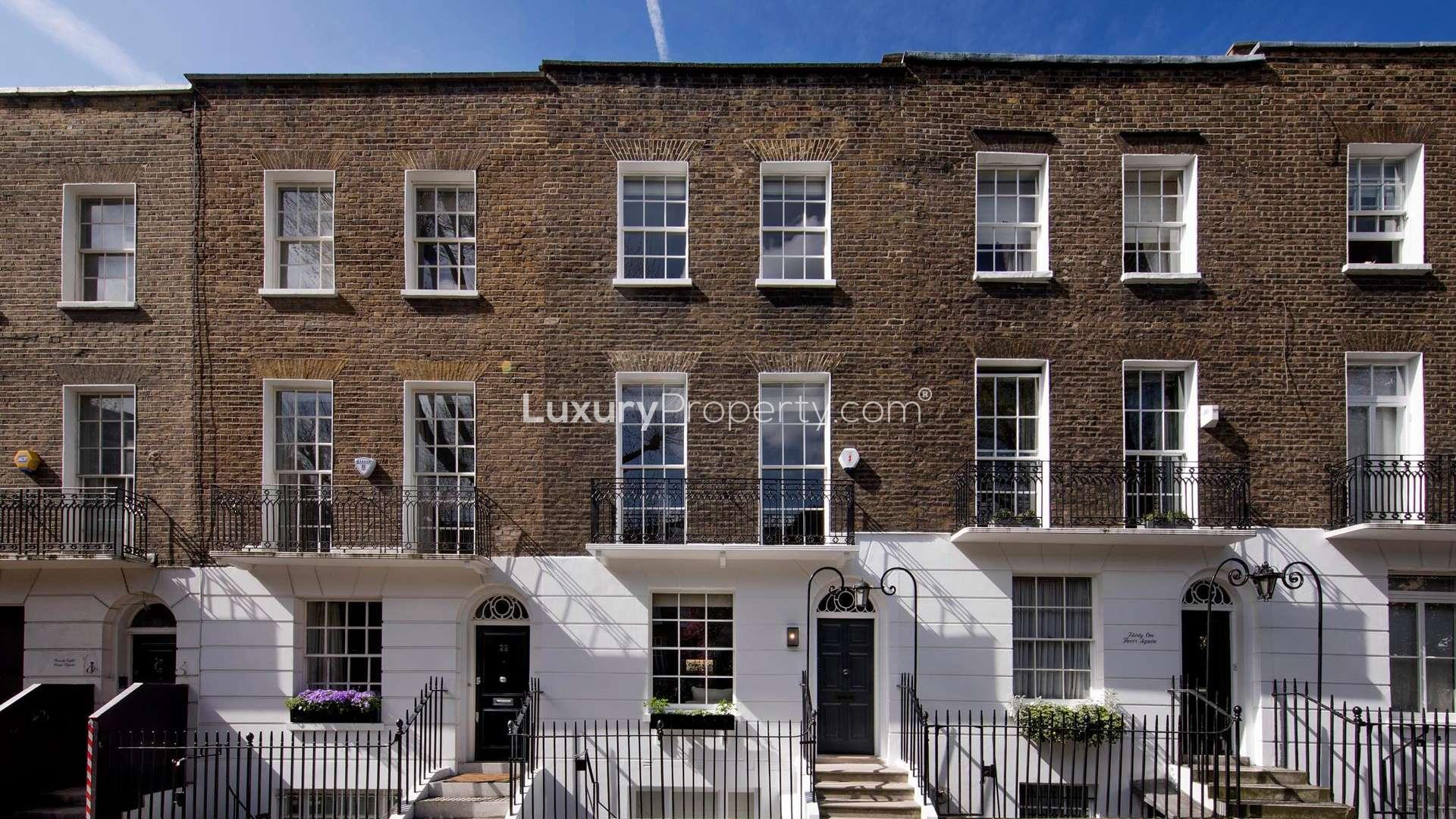 Private courtyard of a 3-bedroom villa in Knightsbridge, London, with brick walls and greenery