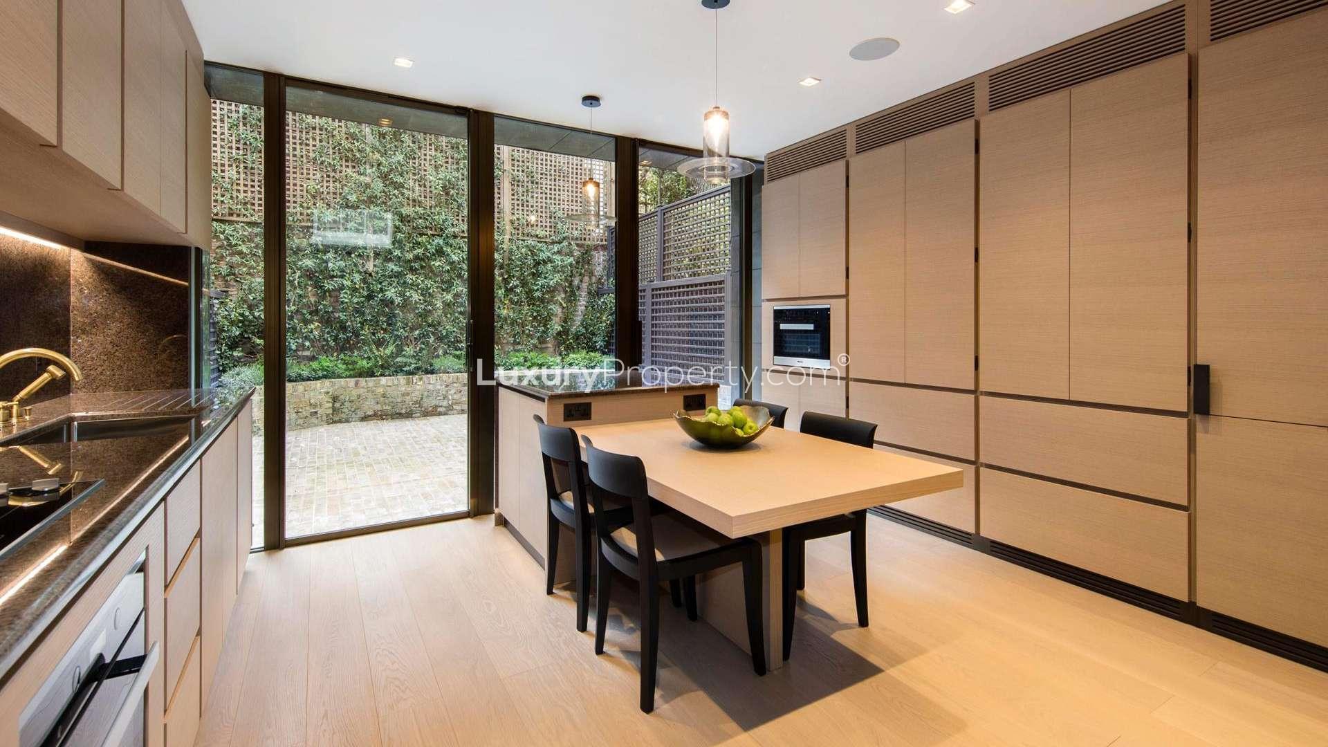 Luxurious bedroom in 3-bedroom villa, Knightsbridge, London, with large windows and modern decor