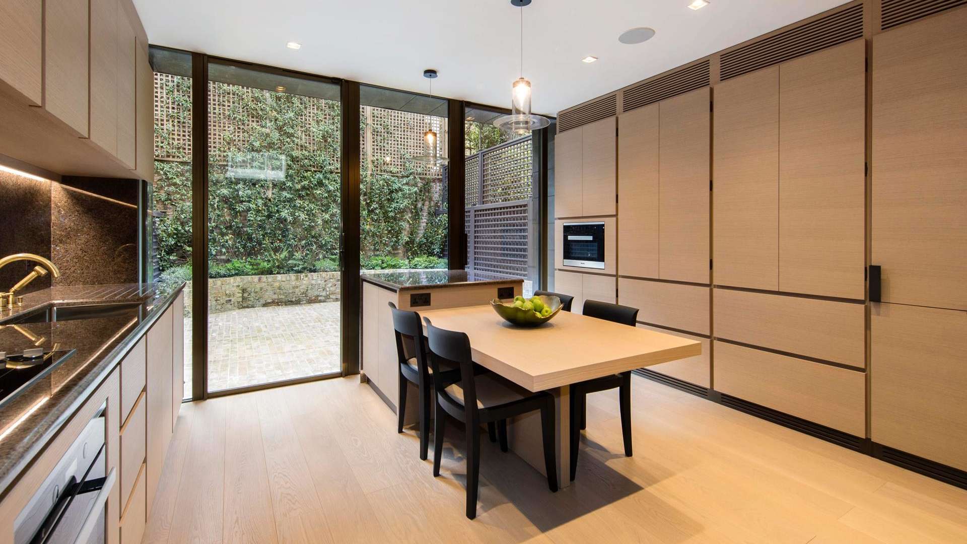 Luxurious bedroom in 3-bedroom villa, Knightsbridge, London, with large windows and modern decor