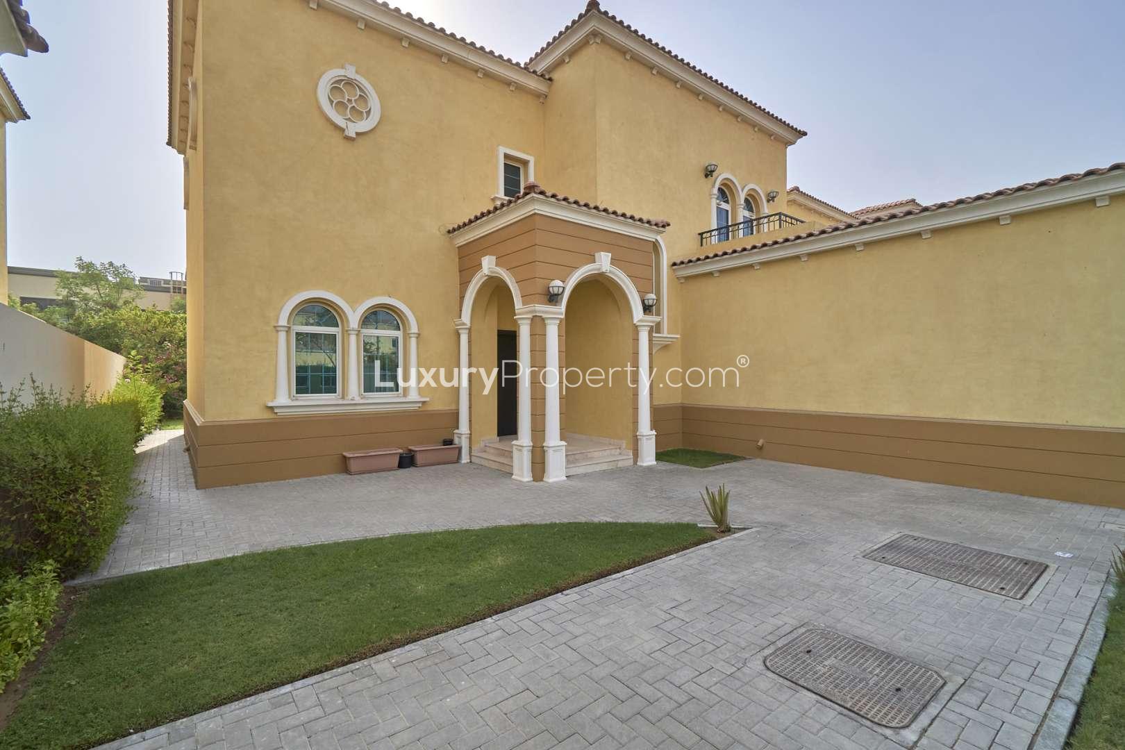 Splendid 3-bed Legacy Villa exterior with driveway, Jumeirah Park, lush greenery, for sale
