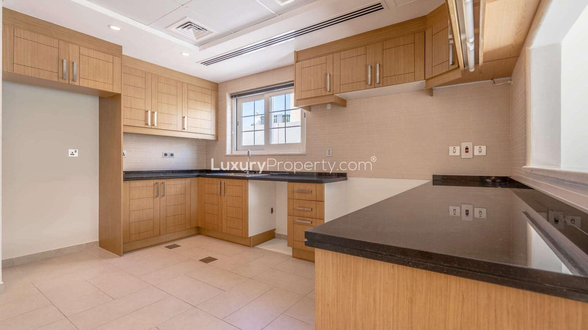 Bright room with large window in Jumeirah Park Legacy villa, tiled floor