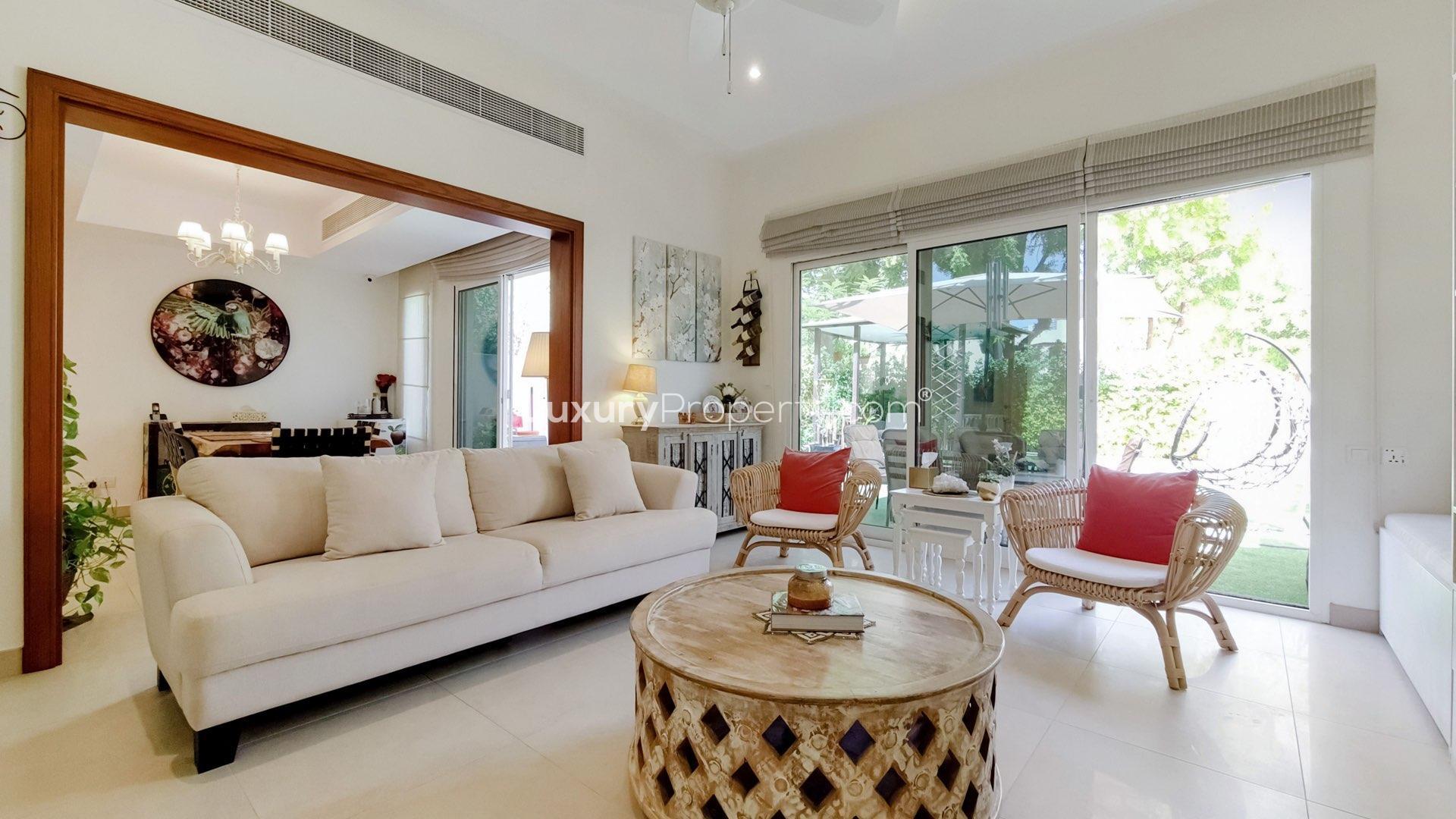 "Charming backyard with gazebo and seating in Maeen villa, The Lakes, for sale.",Modern living room in Maeen villa, The Lakes, with elegant decor and garden view