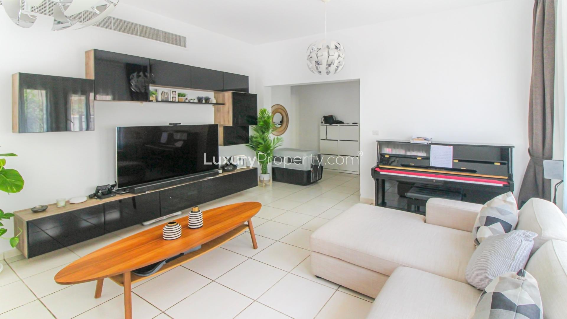 Living room in Maeen villa, The Lakes, with modern decor and natural light