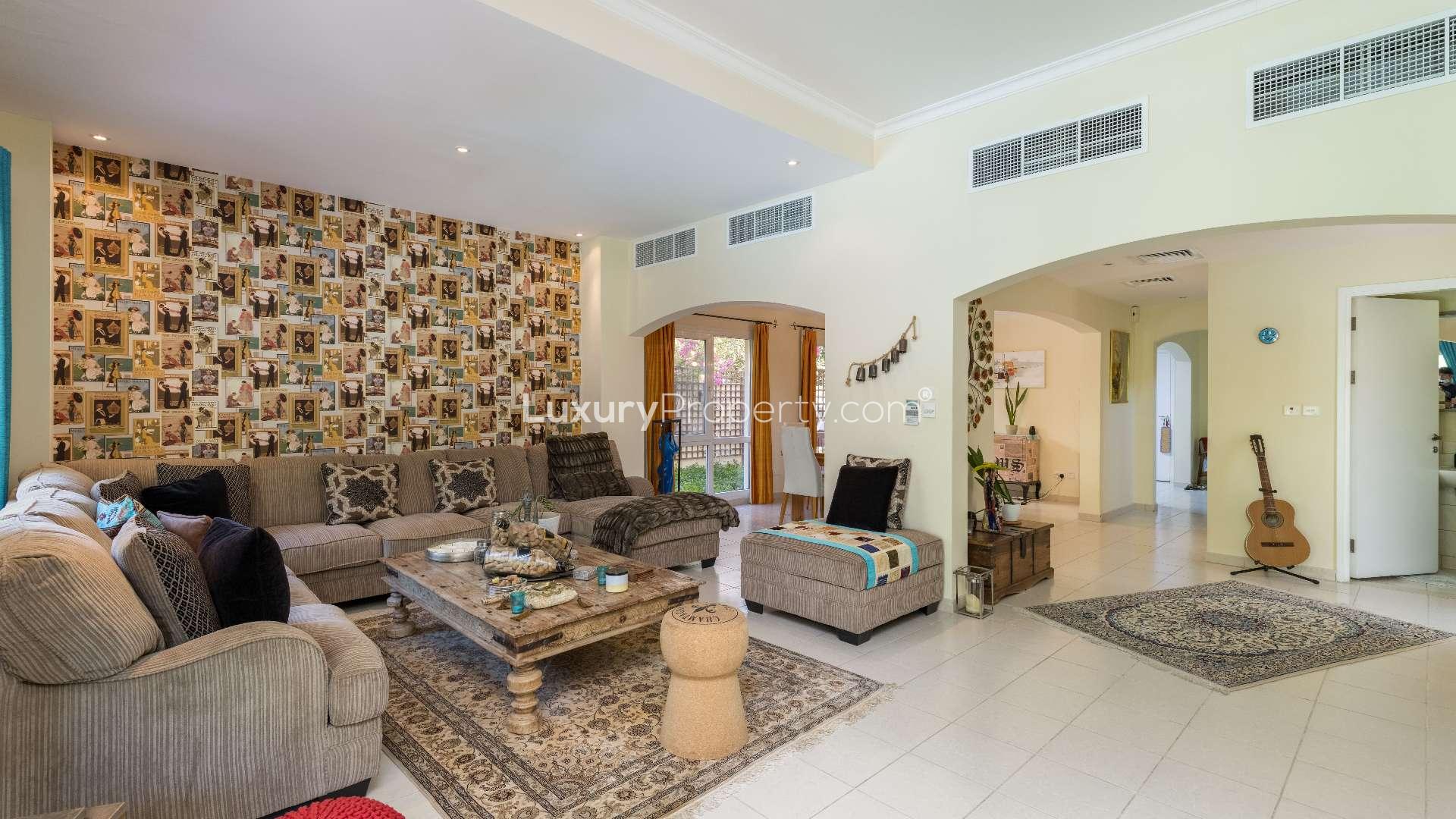 "Bright bedroom with balcony access in Meadows 9 villa for sale, Ref: LP09065.",Living room in Meadows 9 villa with stylish decor and cozy seating area